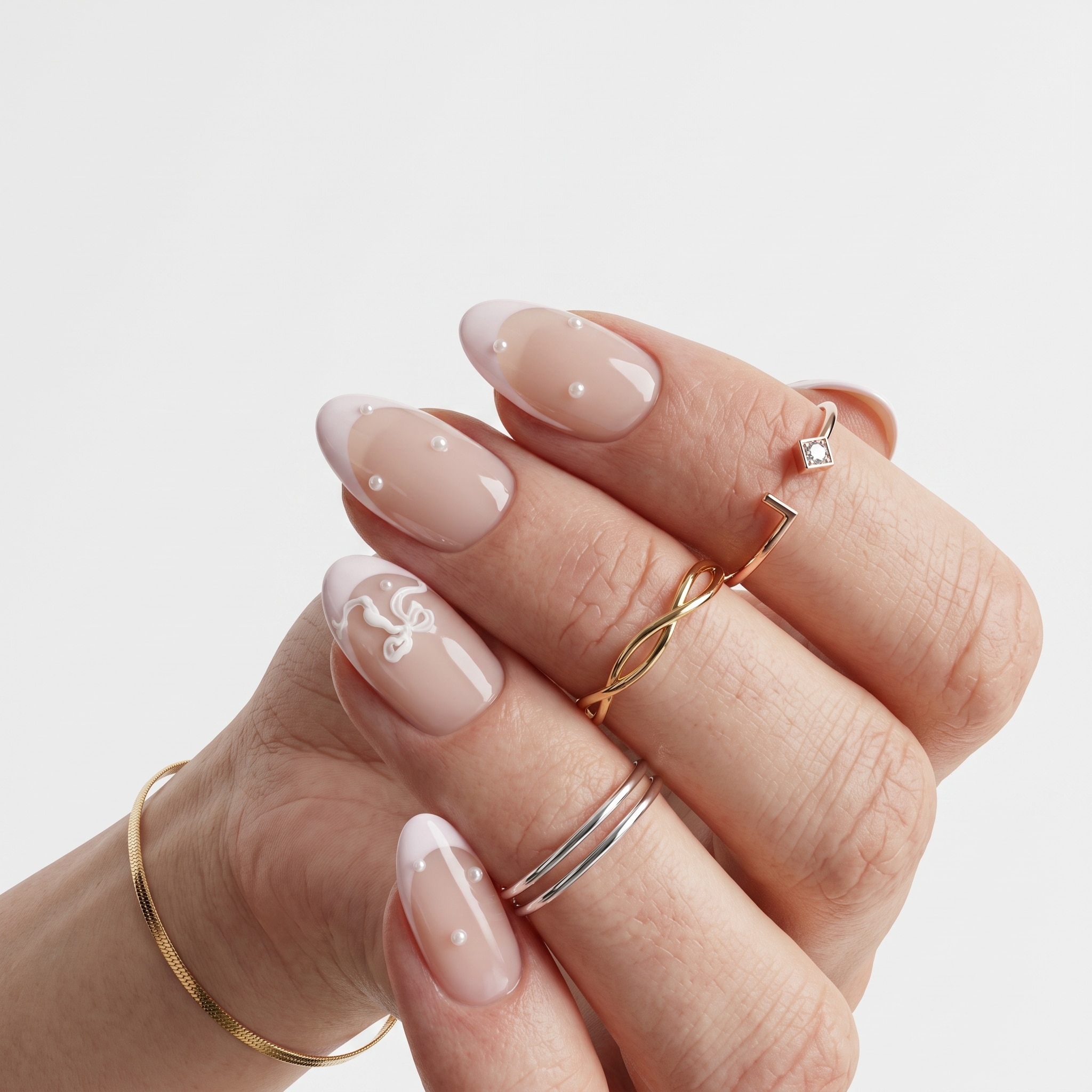 Soft French tip nail art with delicate nude polish and elegant hand pose