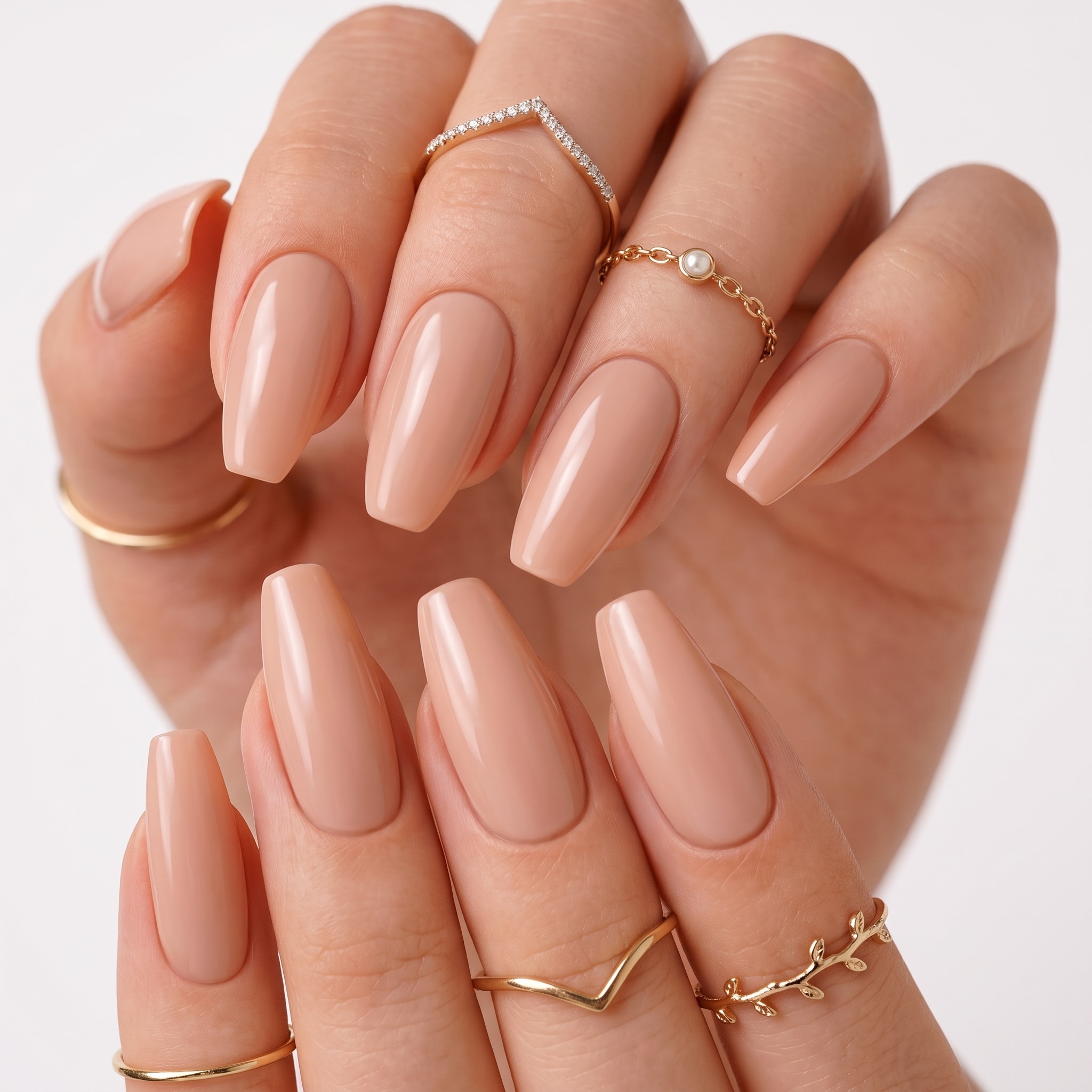 Elegant nude nail shapes on glossy almond style manicured hands