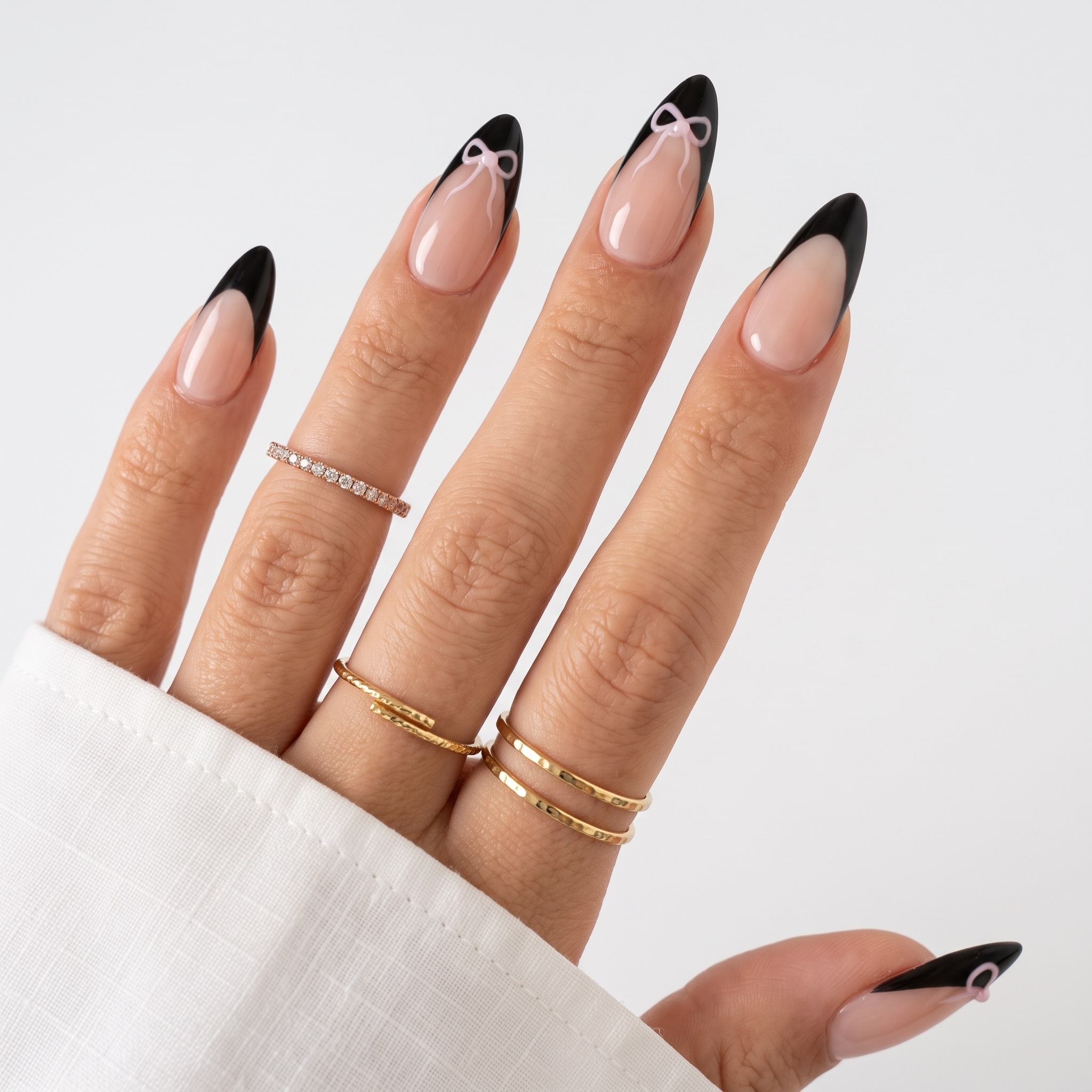 Black French tip nail designs on long glossy almond nails