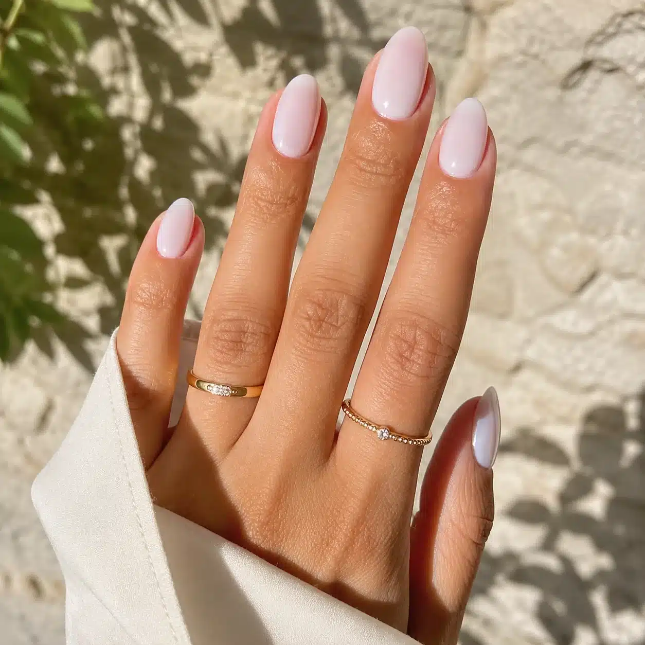 Milky White Gel Nails: 8 Soft, Glossy Manicure Ideas 2 Milky white gel nails with a soft pink base