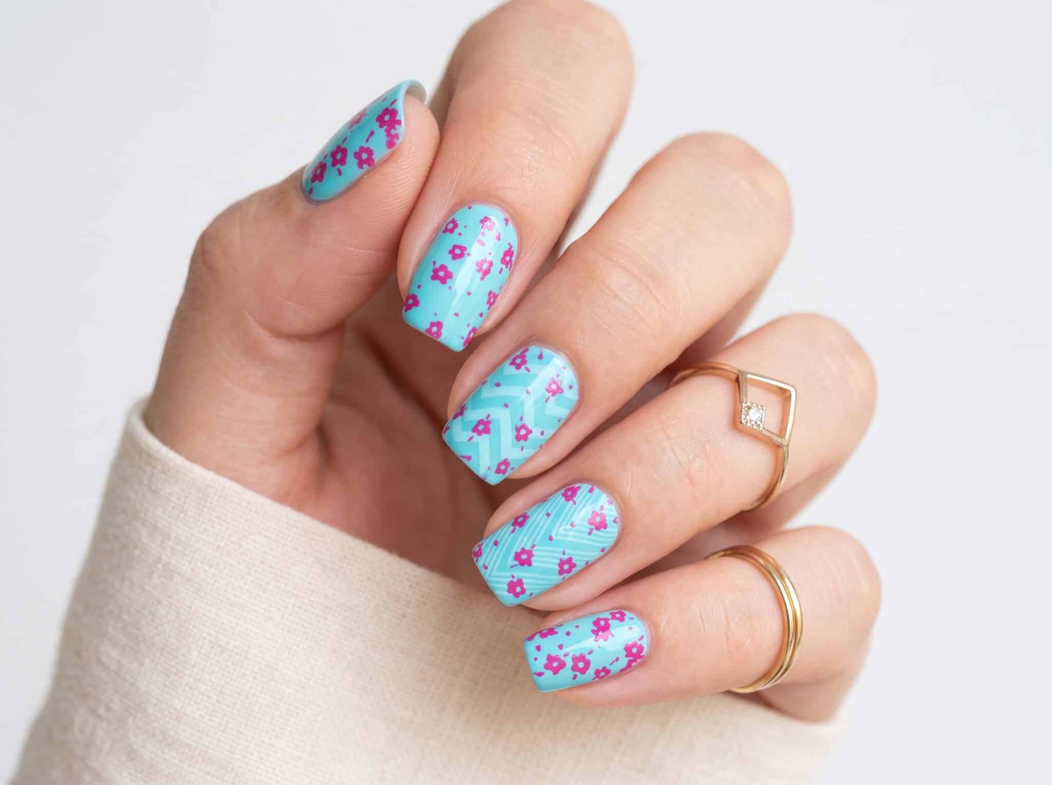 Almond pink aqua polish nails with a clean glossy finish