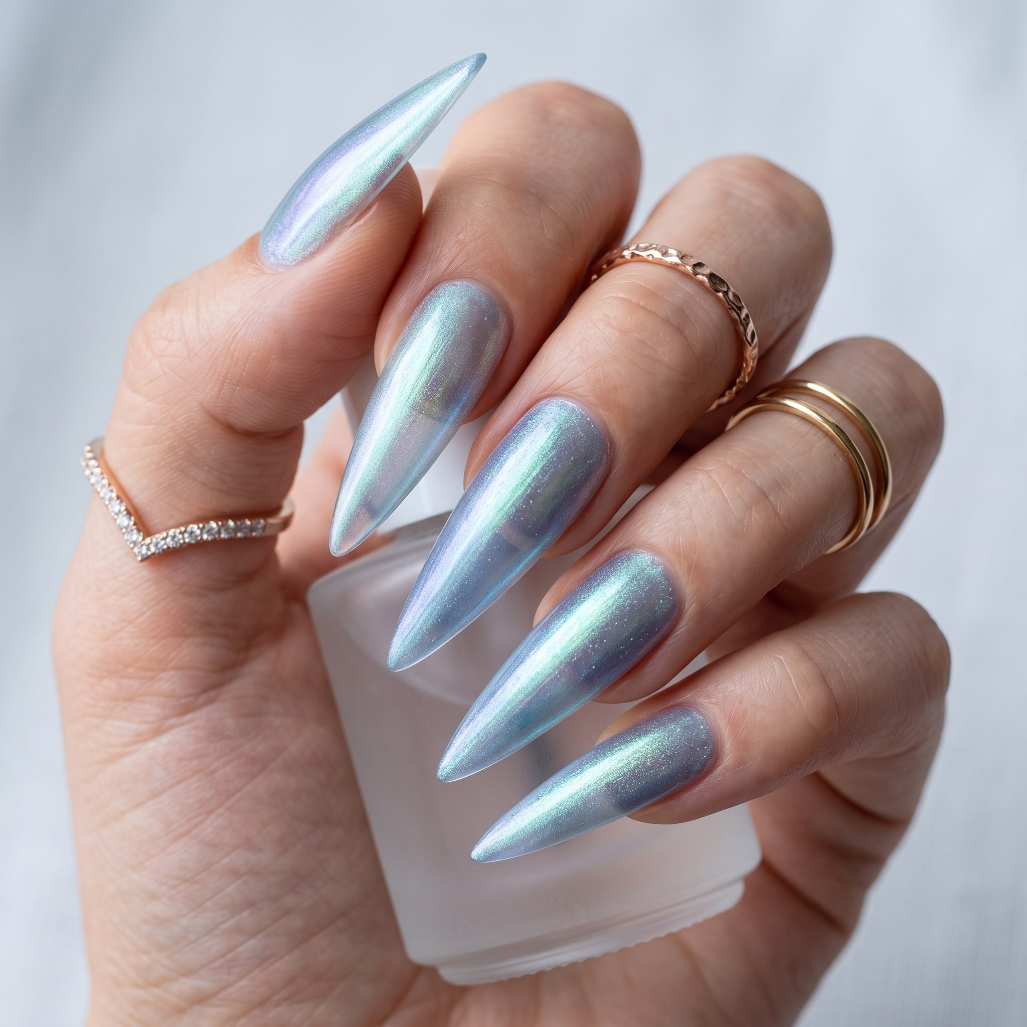 Elegant pink aqua nail polish look with long glossy nails