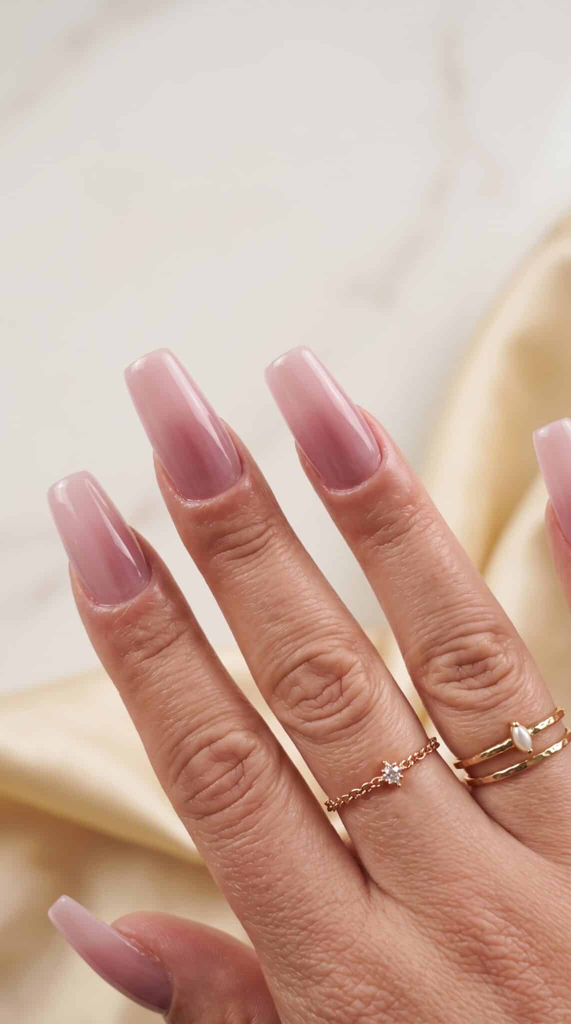 Glossy sheer pink aqua polish look on natural nails
