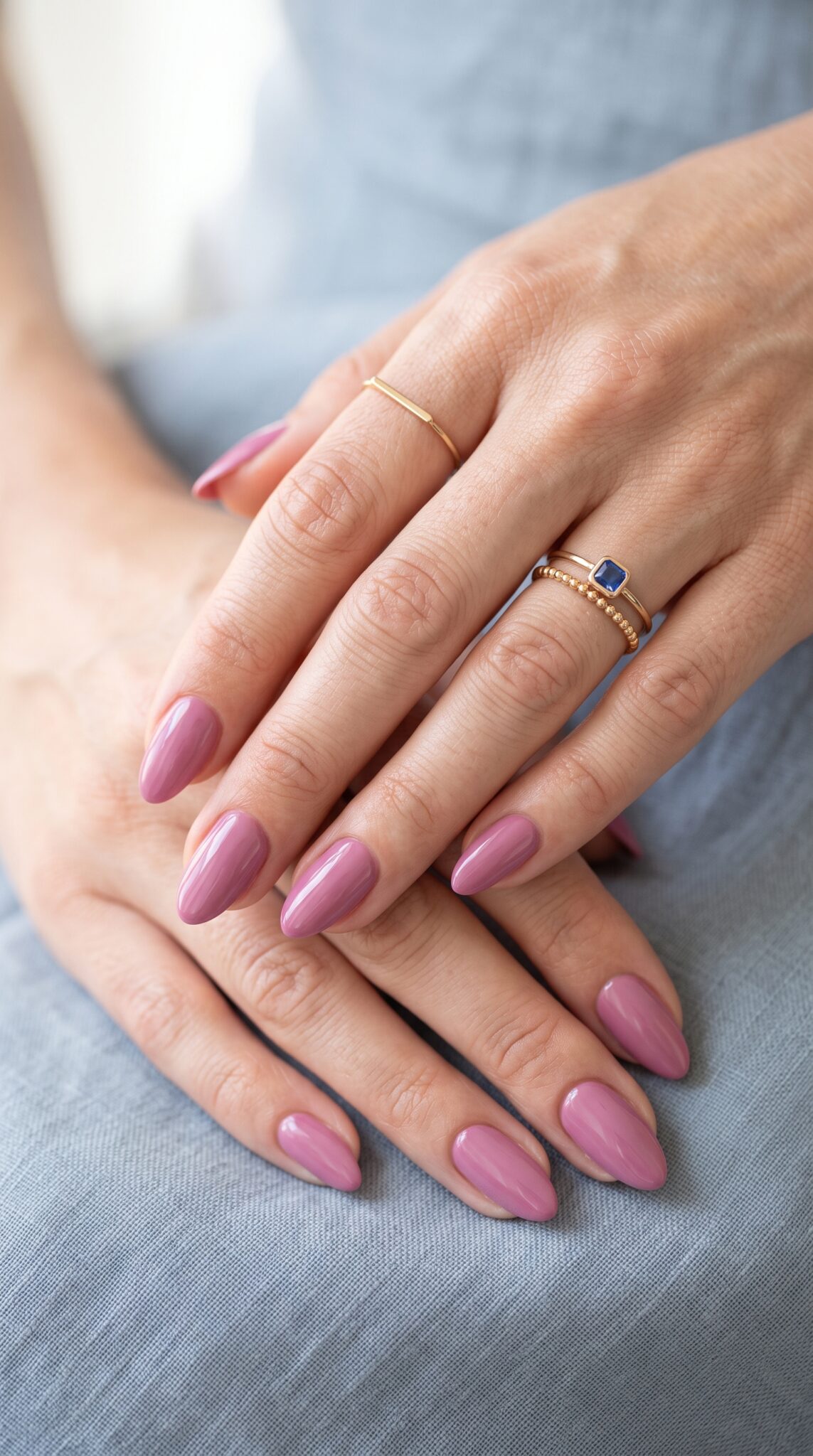 Icy aqua chrome pink nails with long almond shape and reflective shine