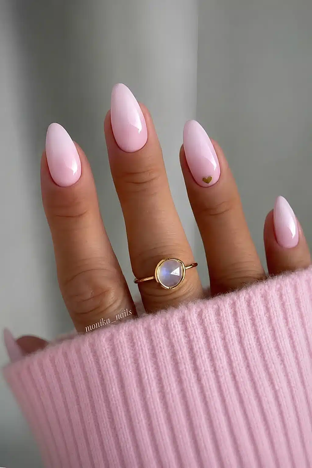 Milky pink almond nails on deep skin