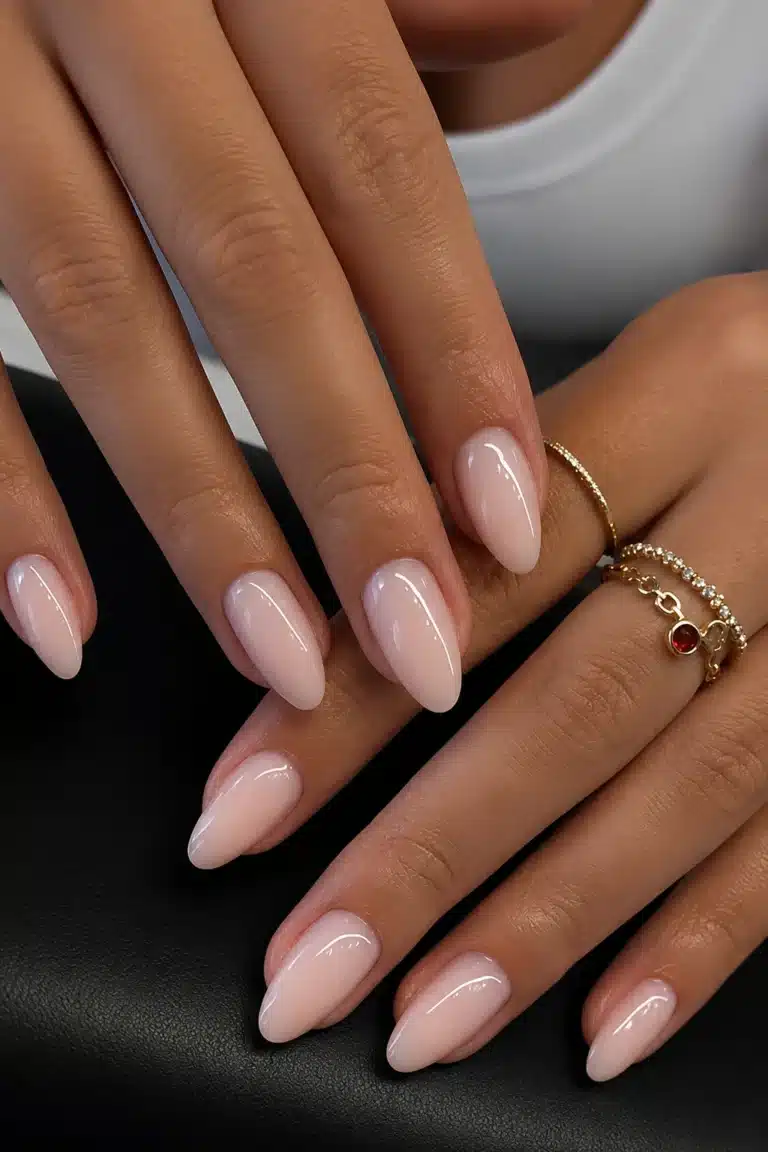 Milky pink almond nails with a soft glossy finish