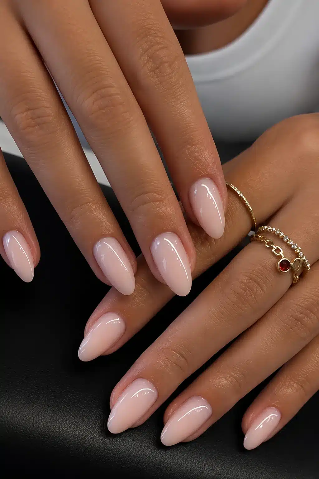 Milky pink almond nails with a soft glossy finish