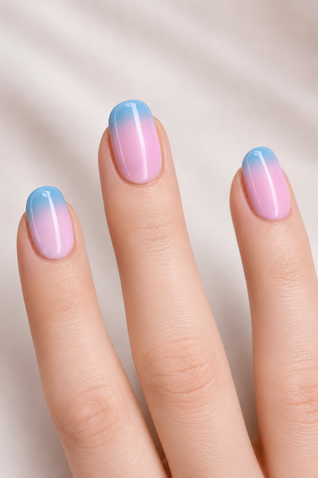 Baby blue and pink tip nails with a clean pastel manicure finish