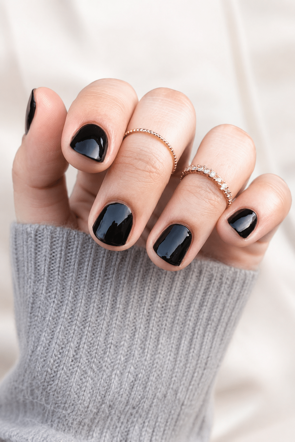 black glitter gel manicure with glossy sparkle finish
