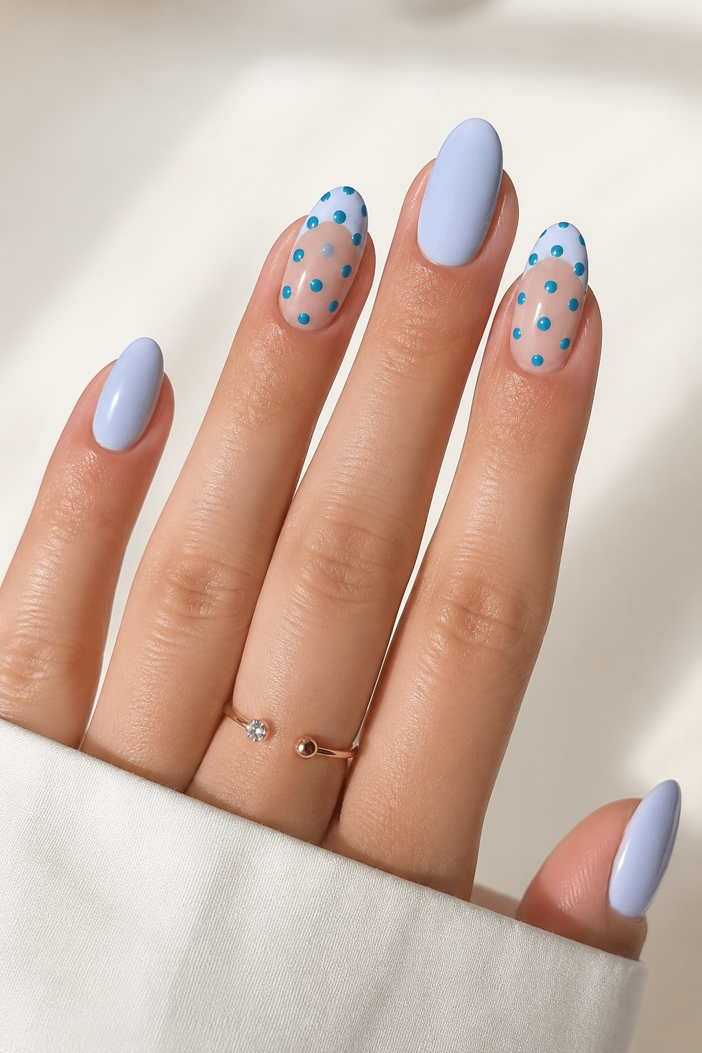 Blue floral short summer nails 2026 with glossy pastel flower details