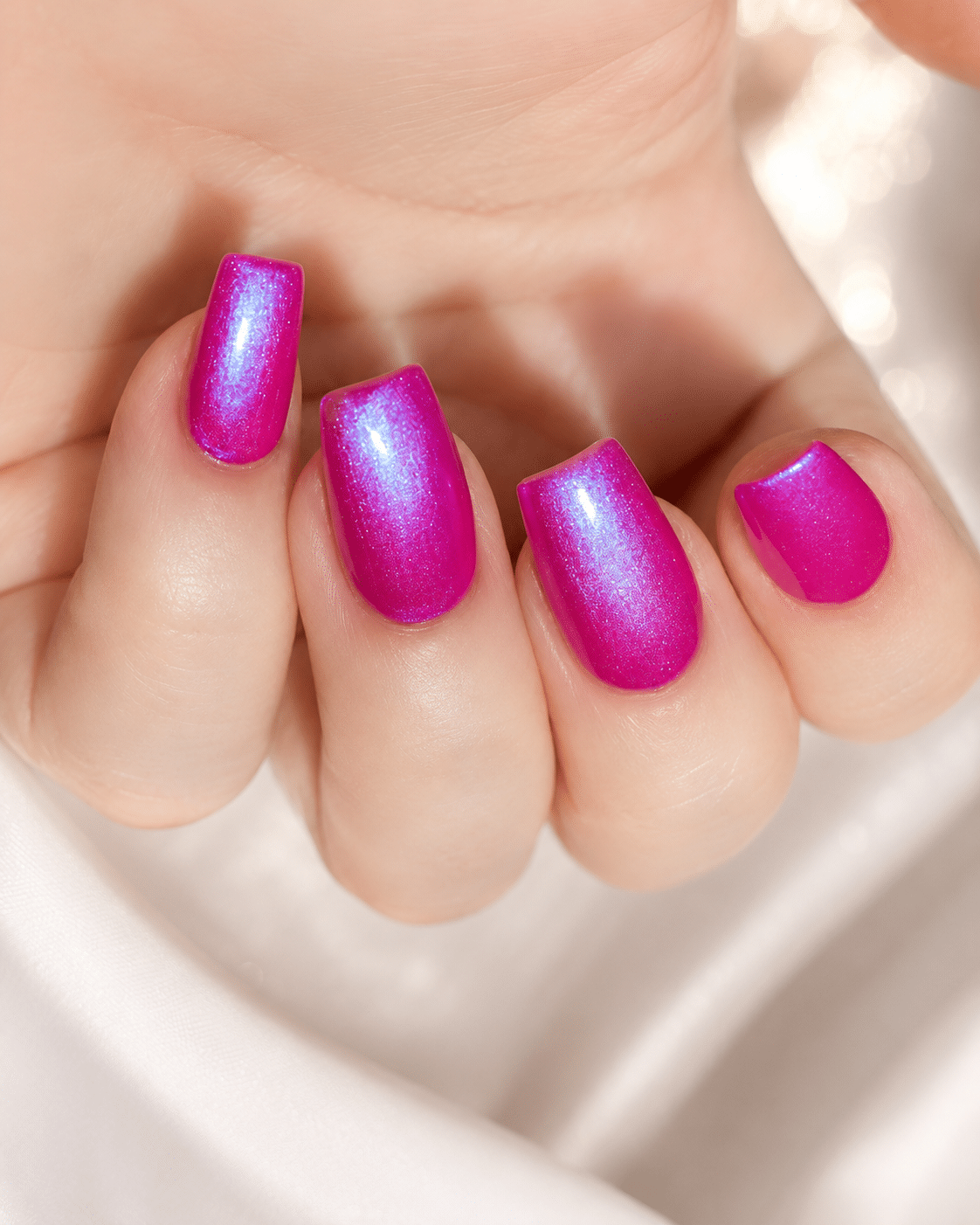 Bright pink and blue glow nails with a glossy shimmer effect