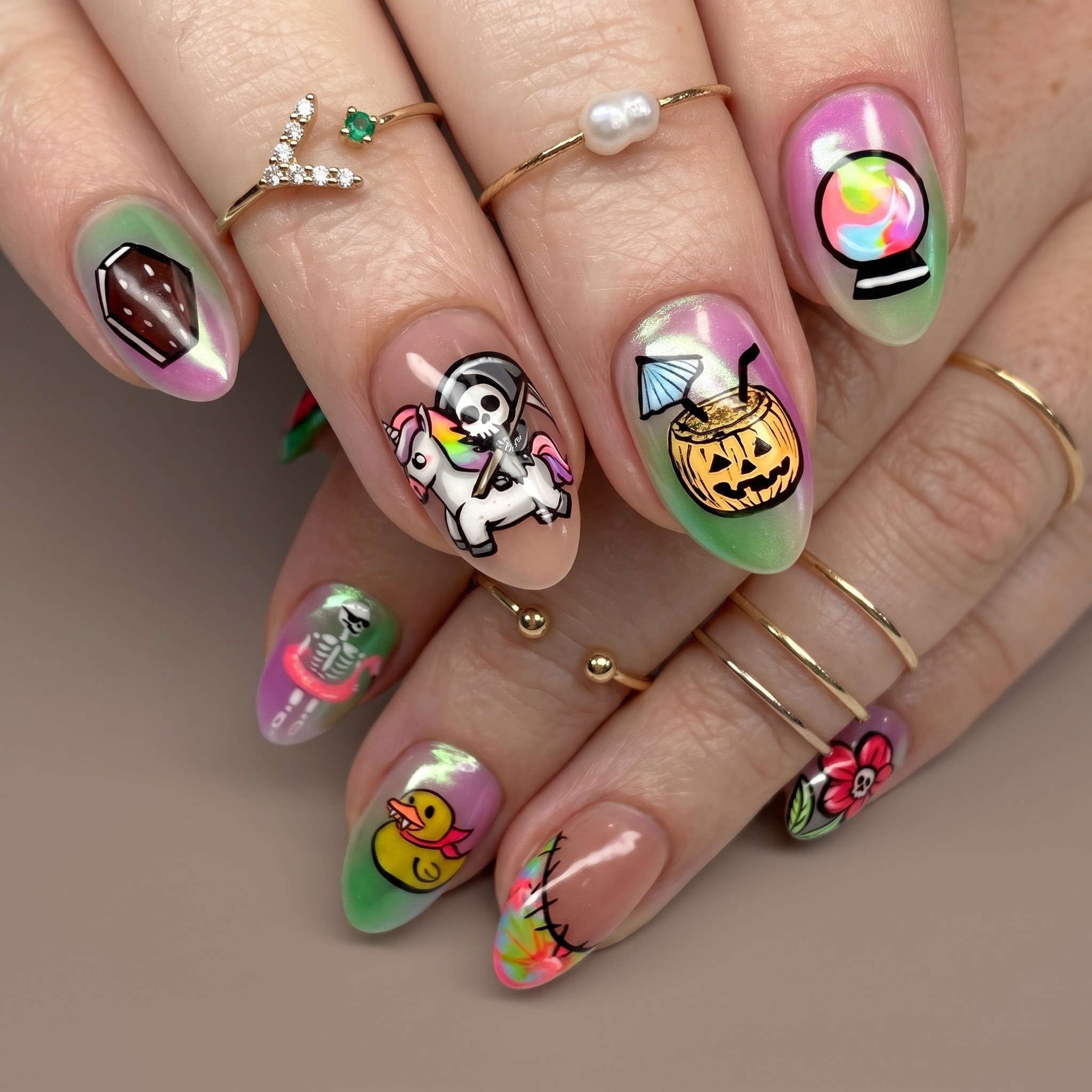 colorful spooky summer nails with ghosts pumpkins and playful icons