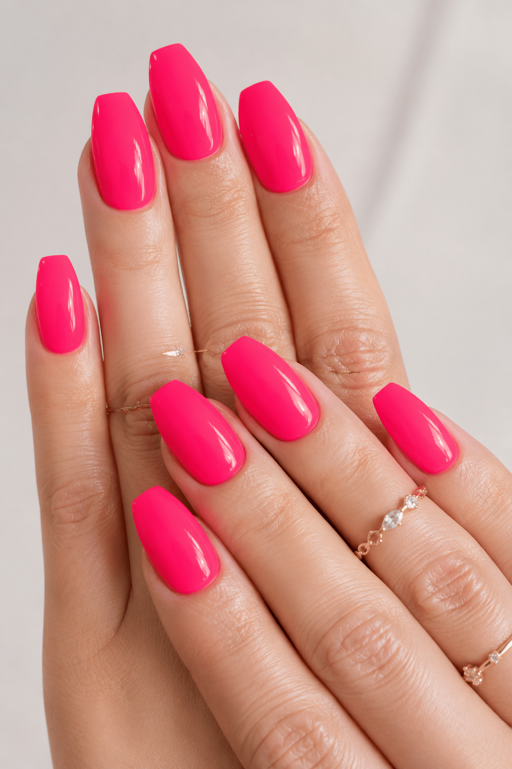 Electric pink cream nails with a glossy neon manicure finish