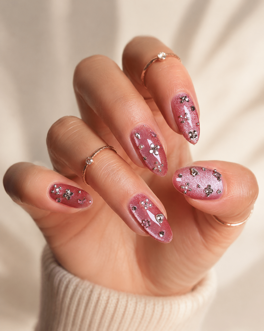 Floral pink cat eye accent nails with glossy magnetic shimmer