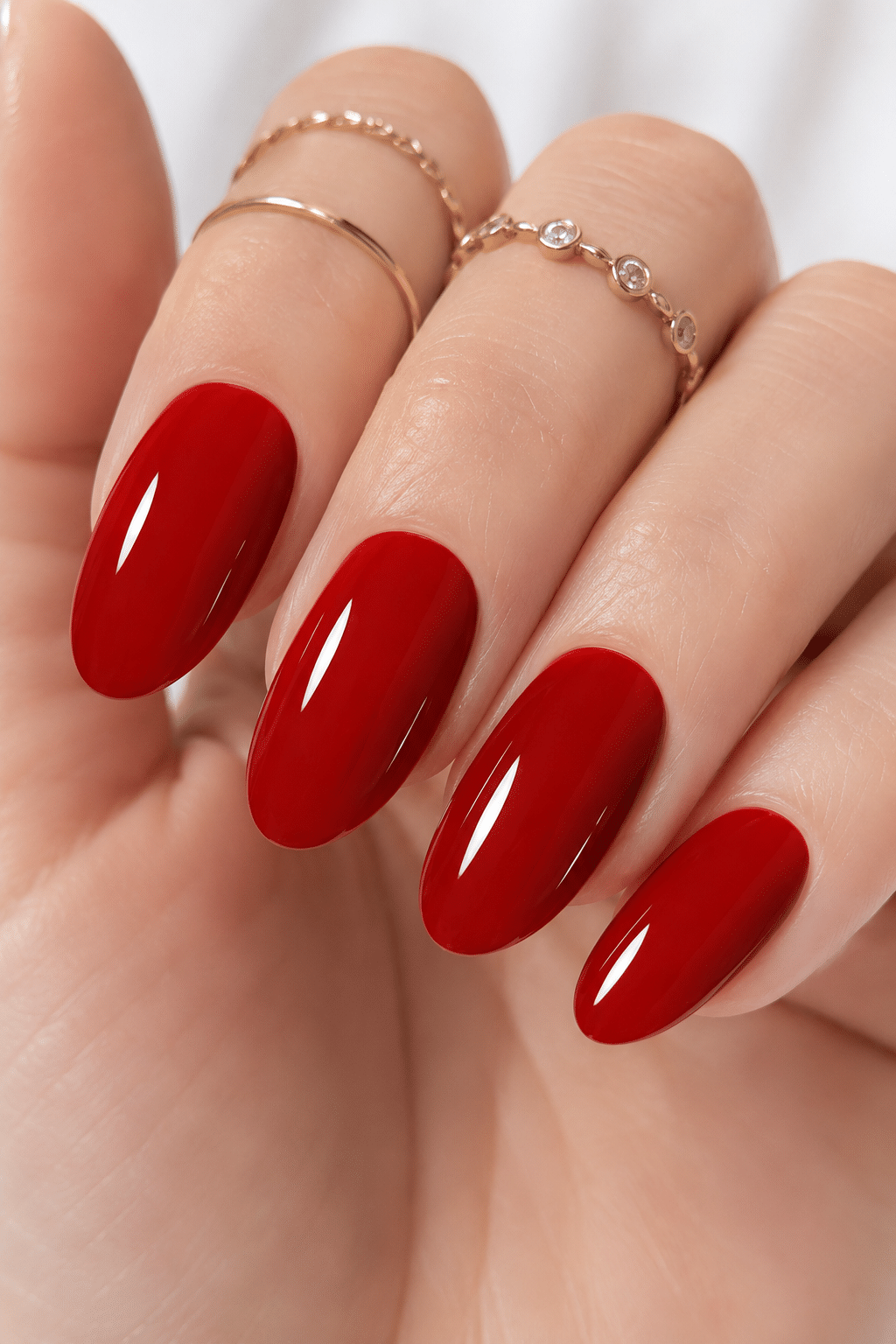 glossy cherry red gel nails with bright classic manicure finish