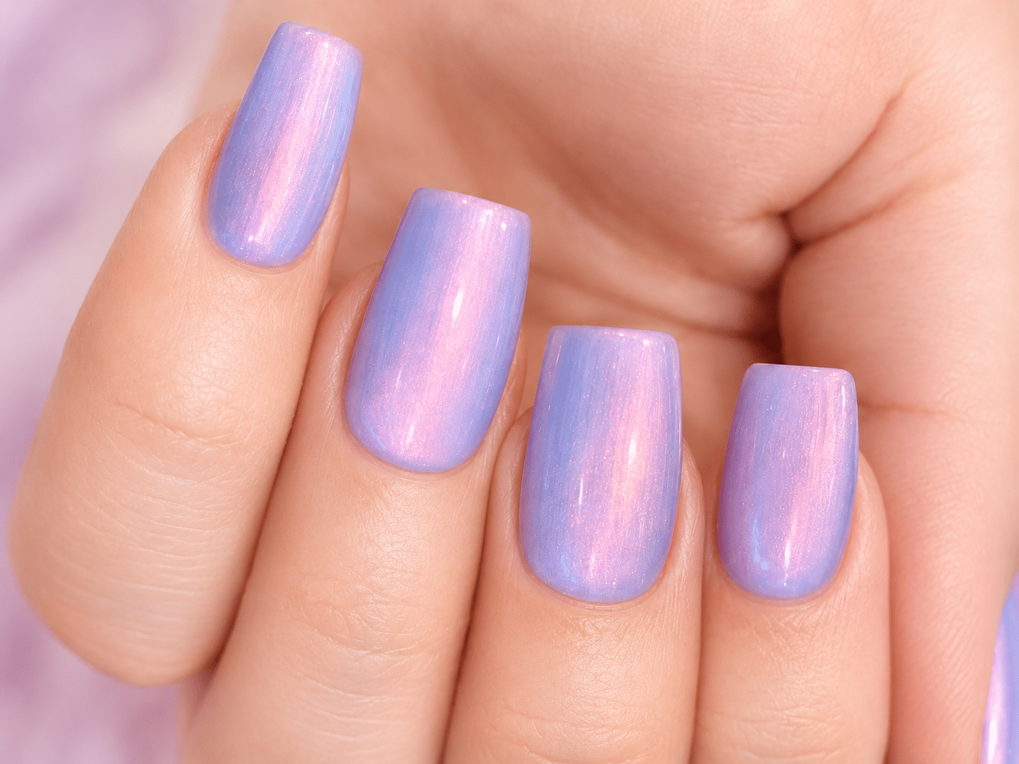 Lavender blue and pink nails with a soft glossy polish finish
