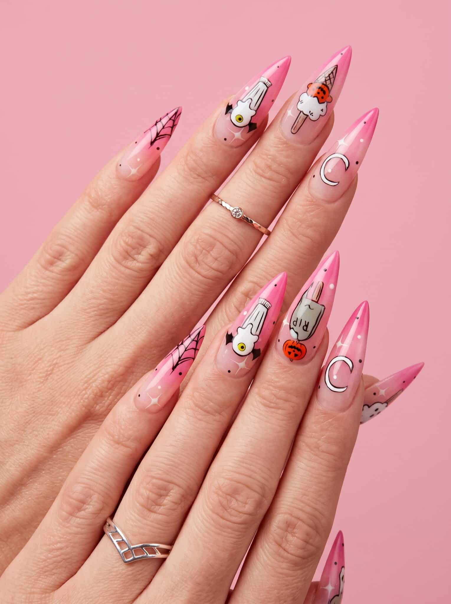 pink almond manicure with delicate spooky summer nail details