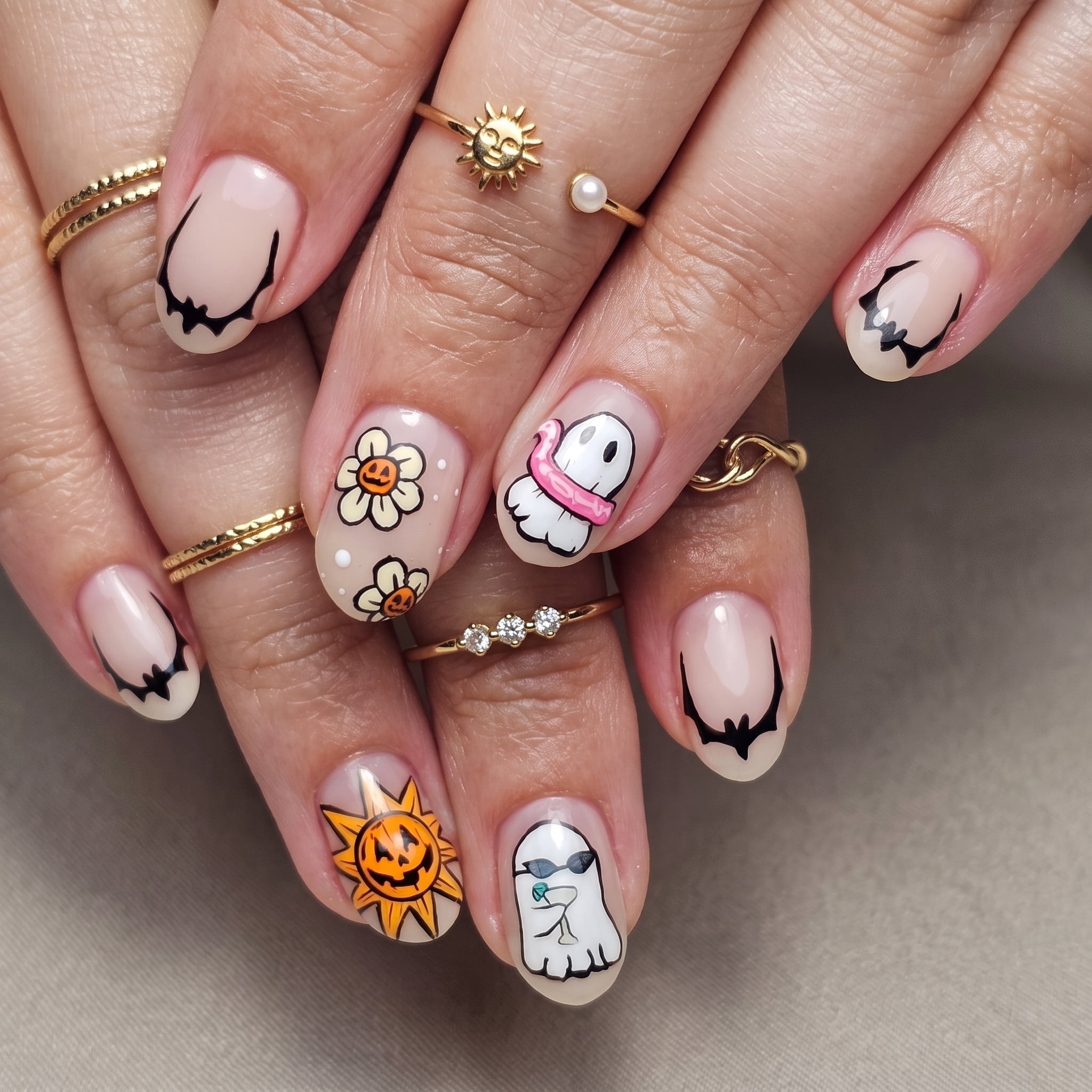 pumpkin ghost and flower manicure with soft nude base