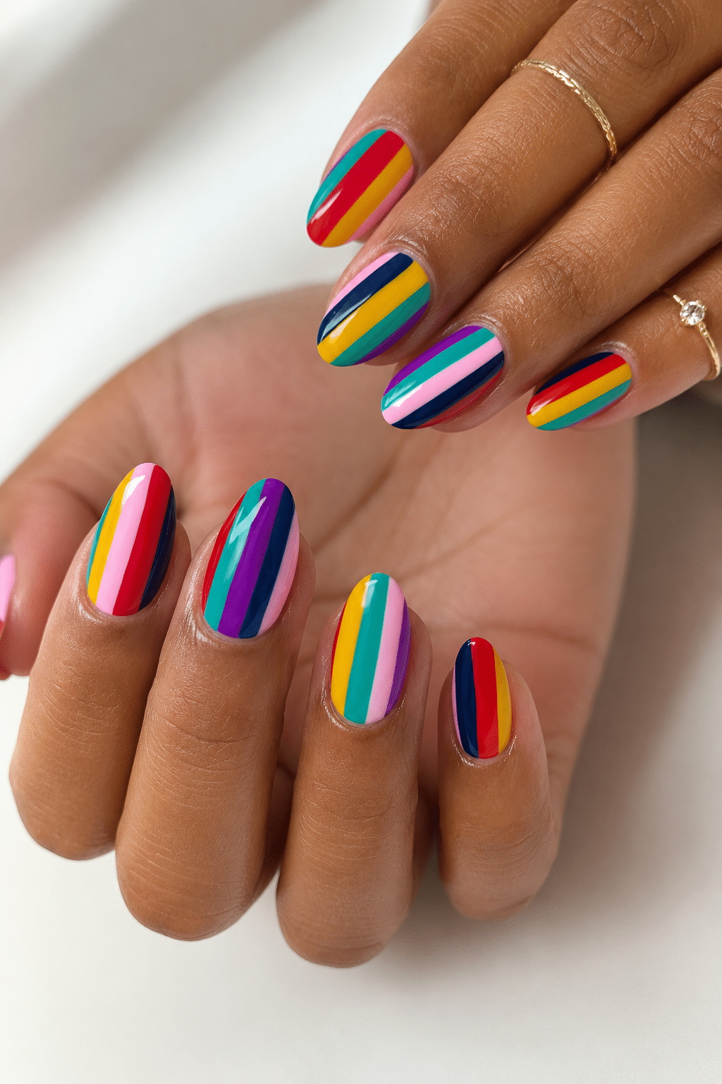 Rainbow chrome summer nail design 2026 with glossy multicolor reflection