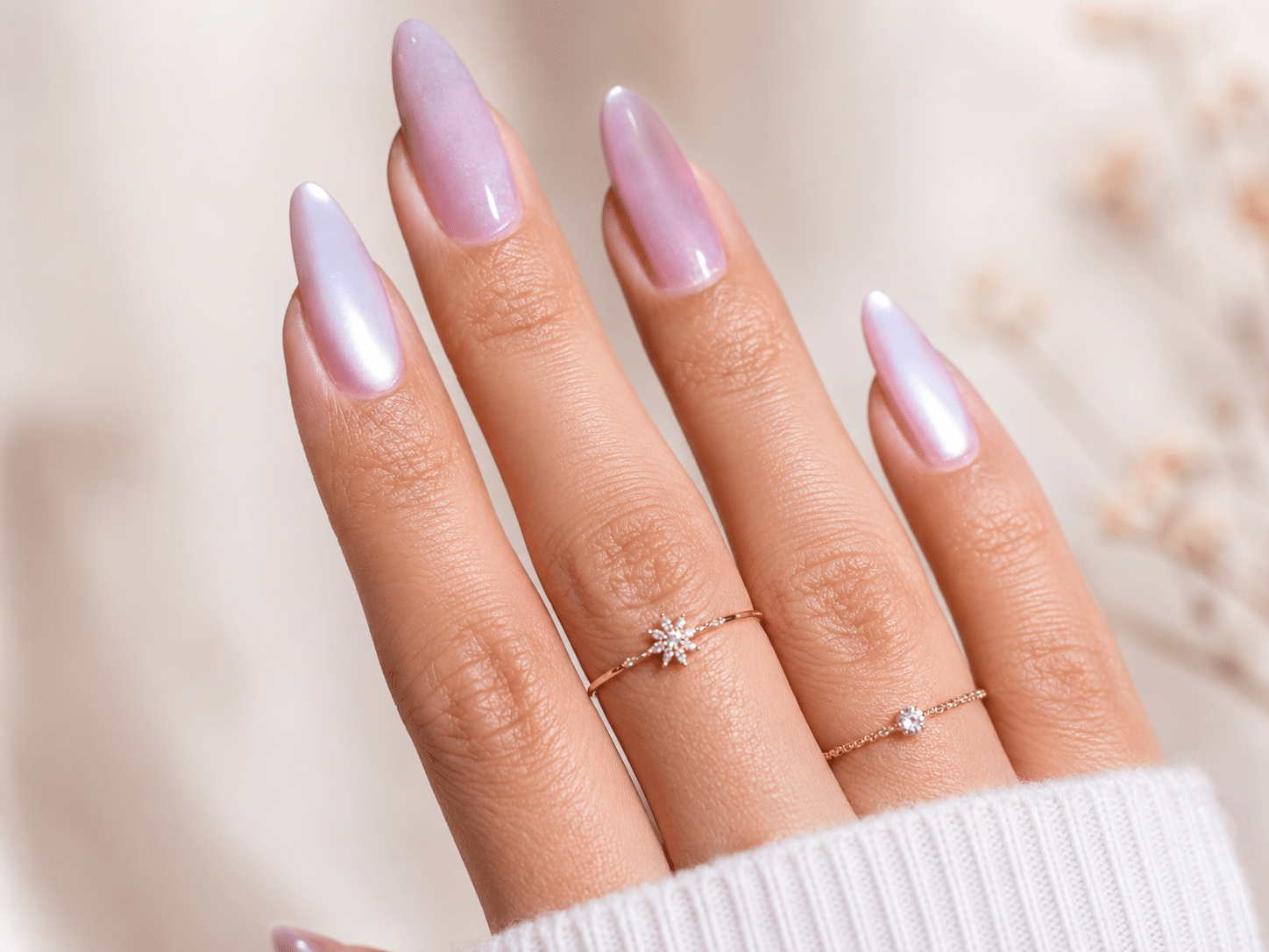 Sheer pink magnetic glow nails with a soft glossy cat eye finish