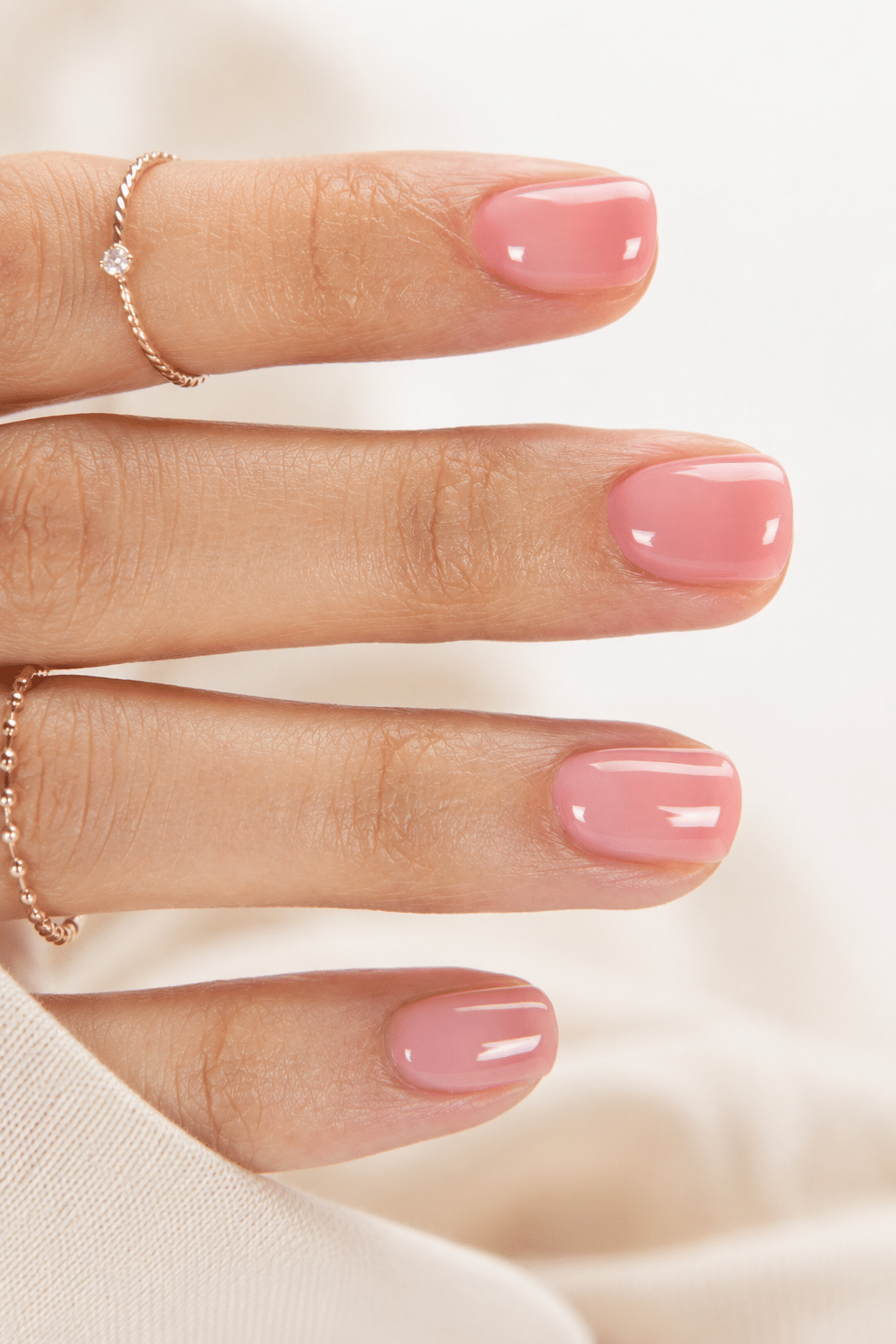 Sheer rose jelly pink gel nails with a translucent glossy finish
