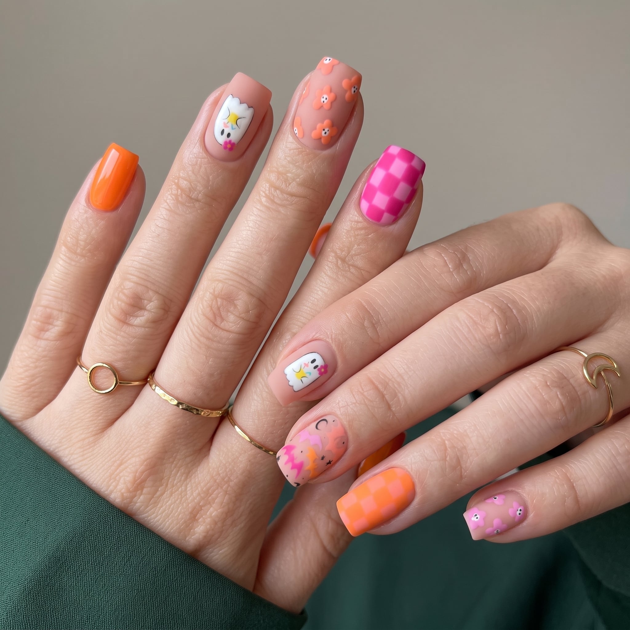 soft orange pink manicure with tiny summerween nail details
