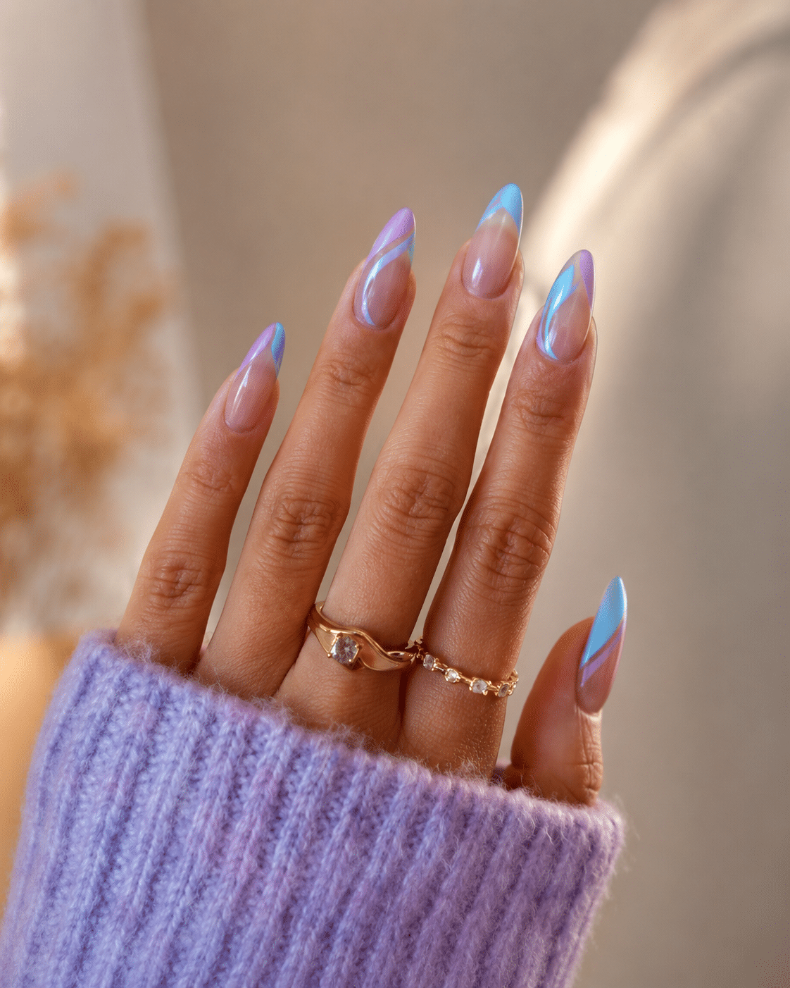Pink and blue almond nails with a soft sweater style manicure mood