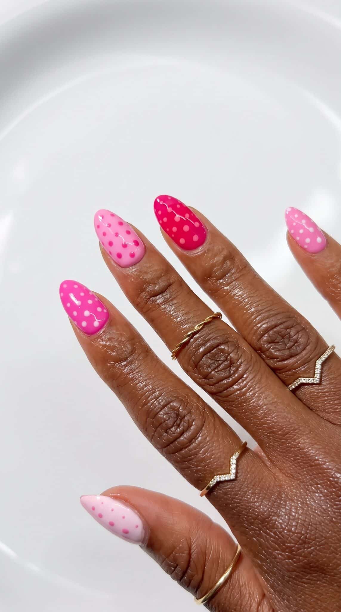 Sheer aqua pink polish hand pose with glossy natural nails