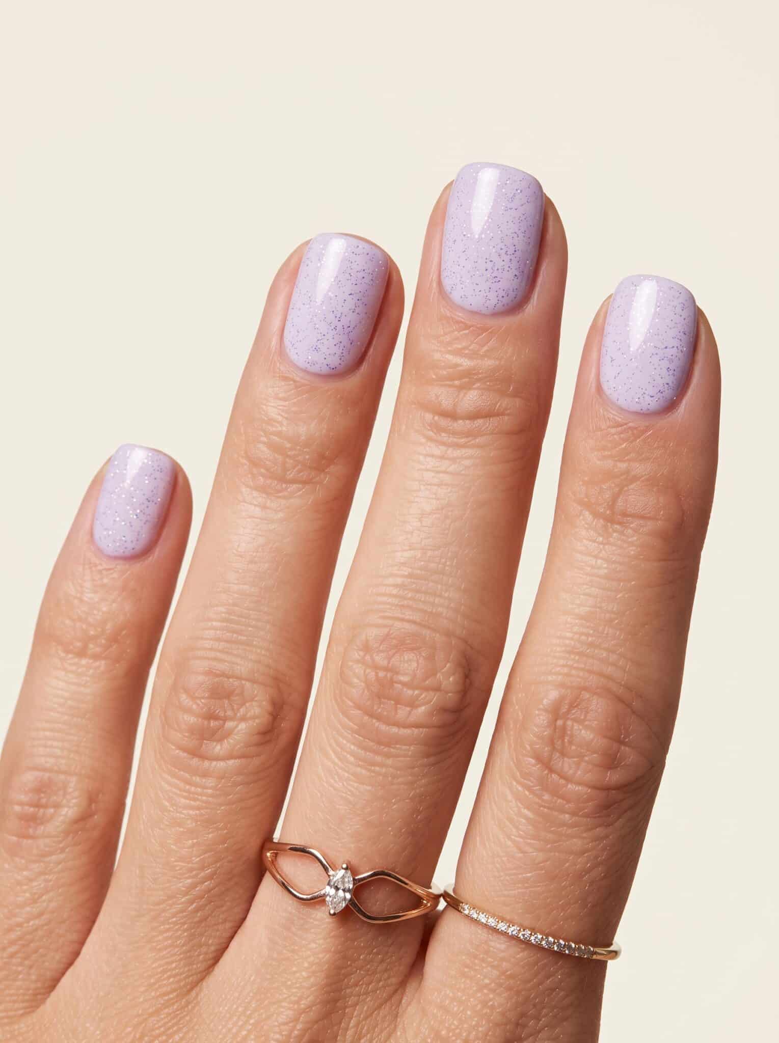 Glossy magenta rounded manicure with bright pink color
