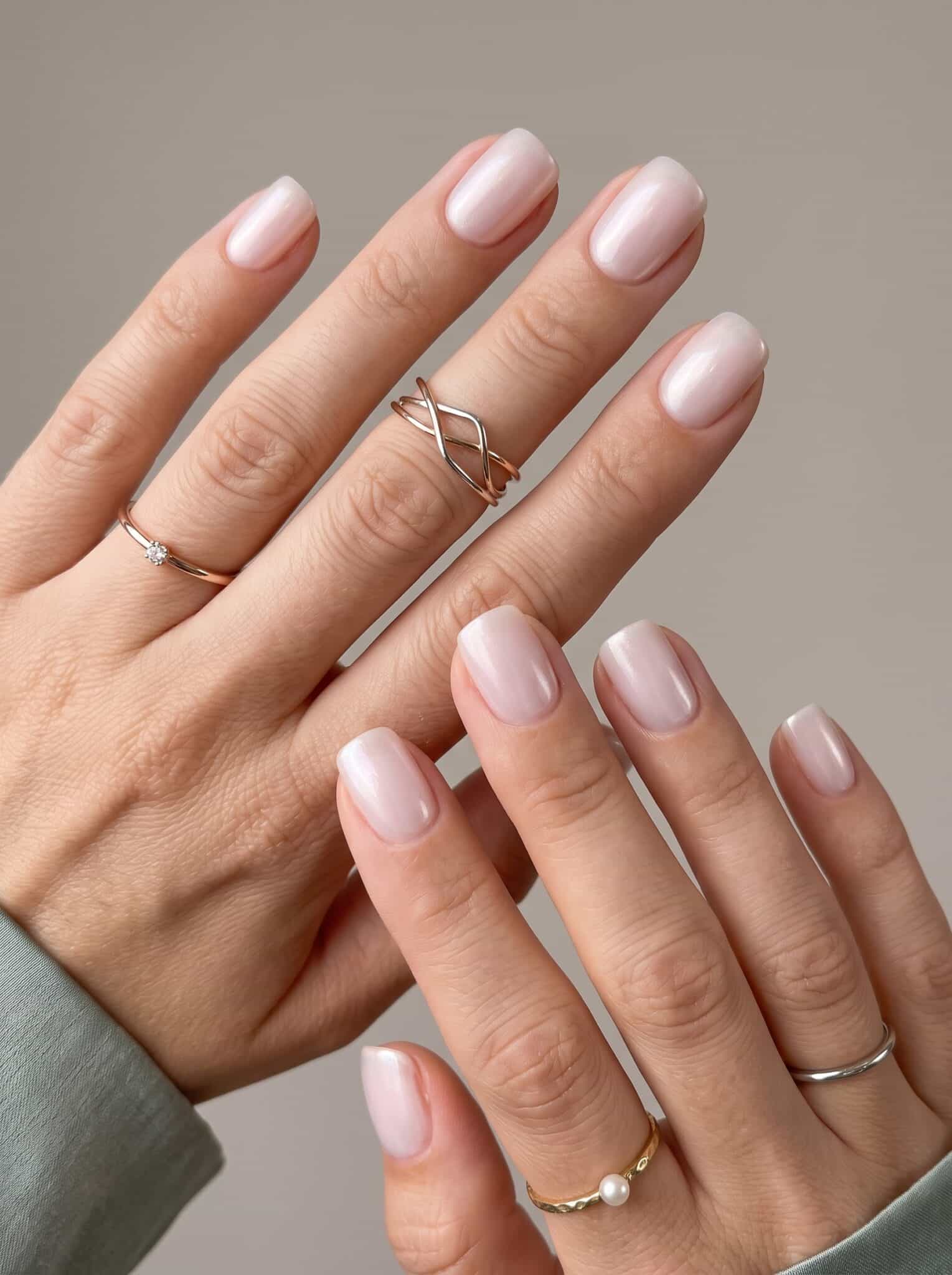 Nude manicure with fine metallic gold tip accents