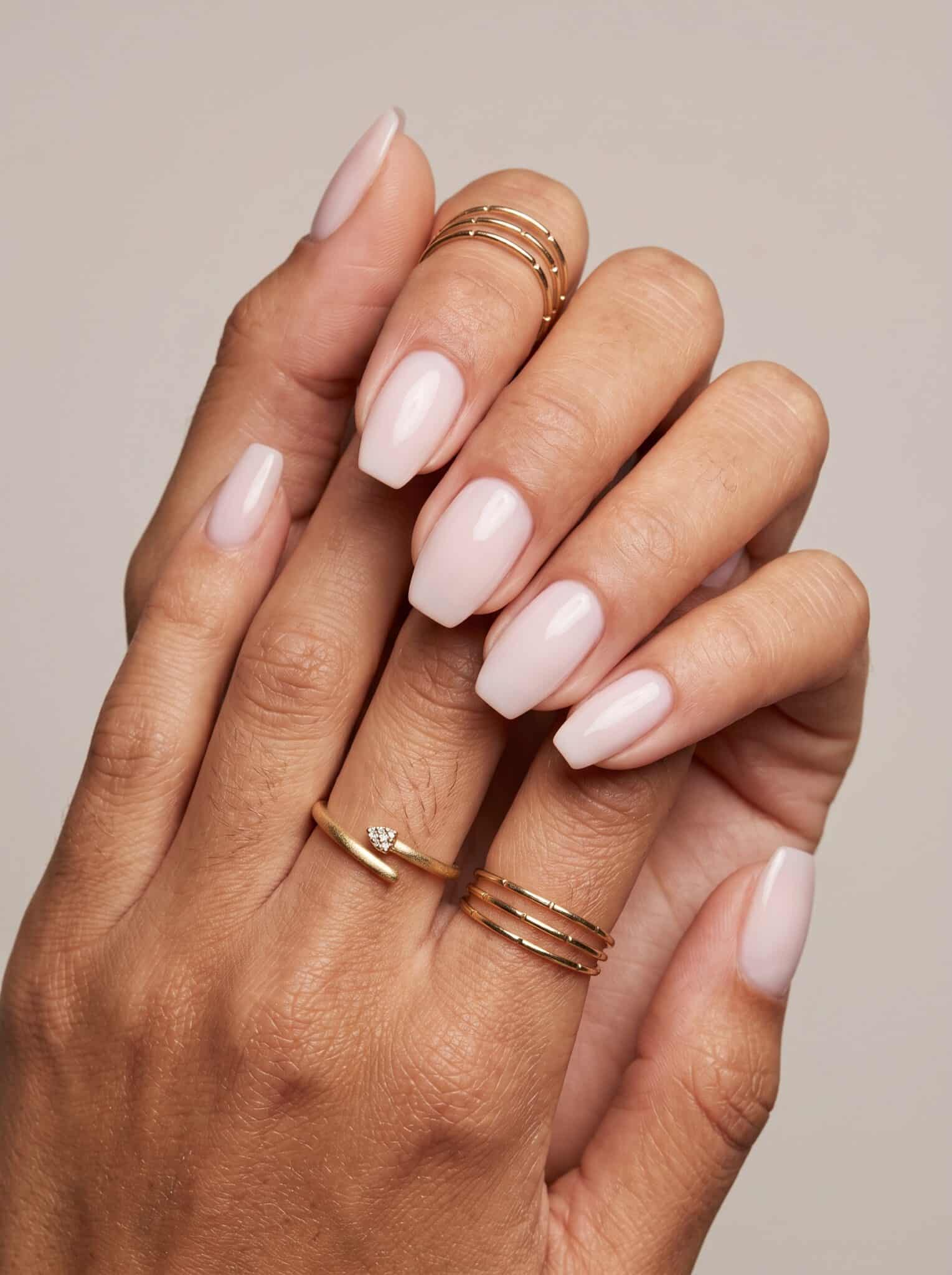 Glossy chocolate brown manicure on short almond nails