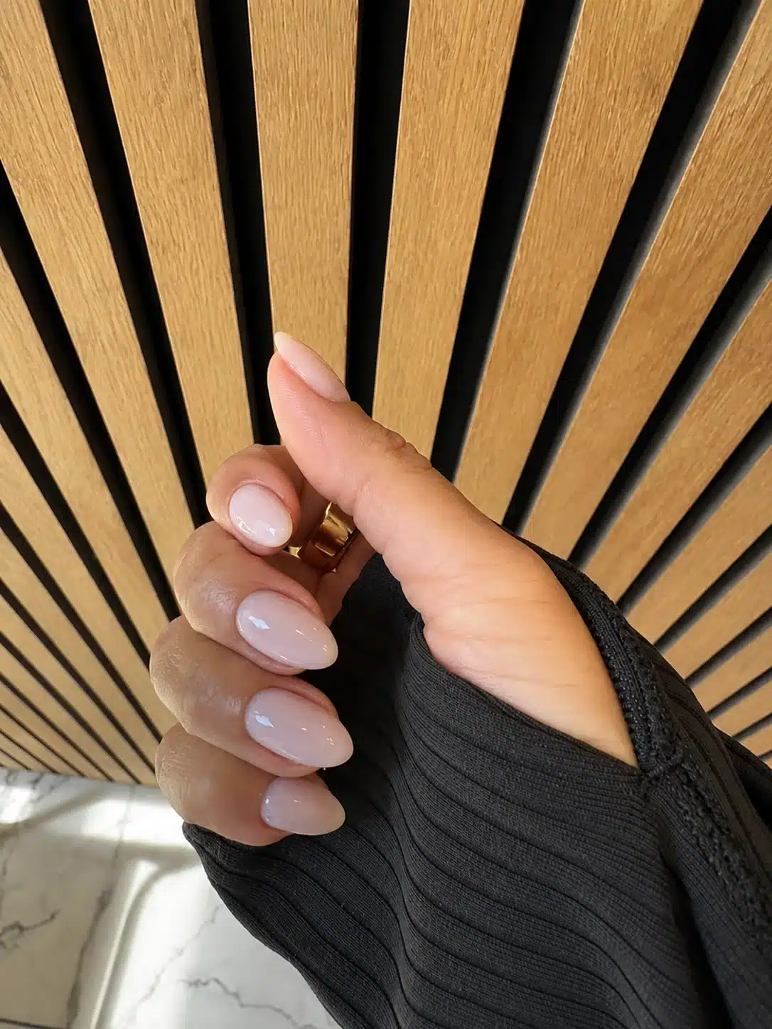 Short milky pink almond nails