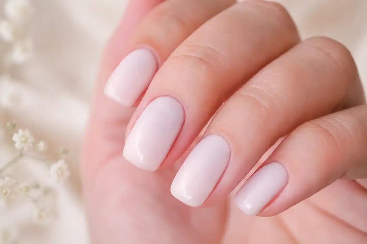 Milky White Acrylic Nails: 10 Ideas for Every Manicure Vibe 9 Short square milky white acrylic nails with a glossy finish