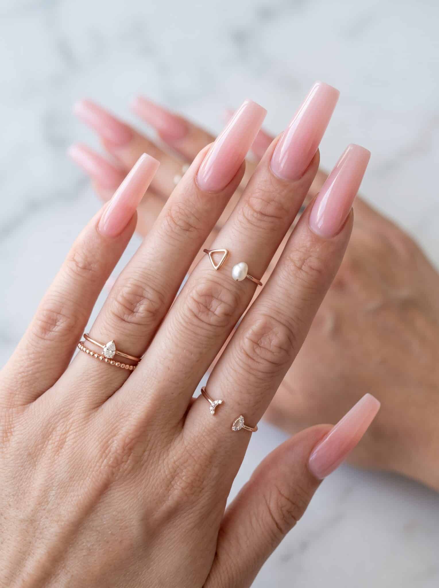 Soft blue aqua pink floral nails with delicate flower accents