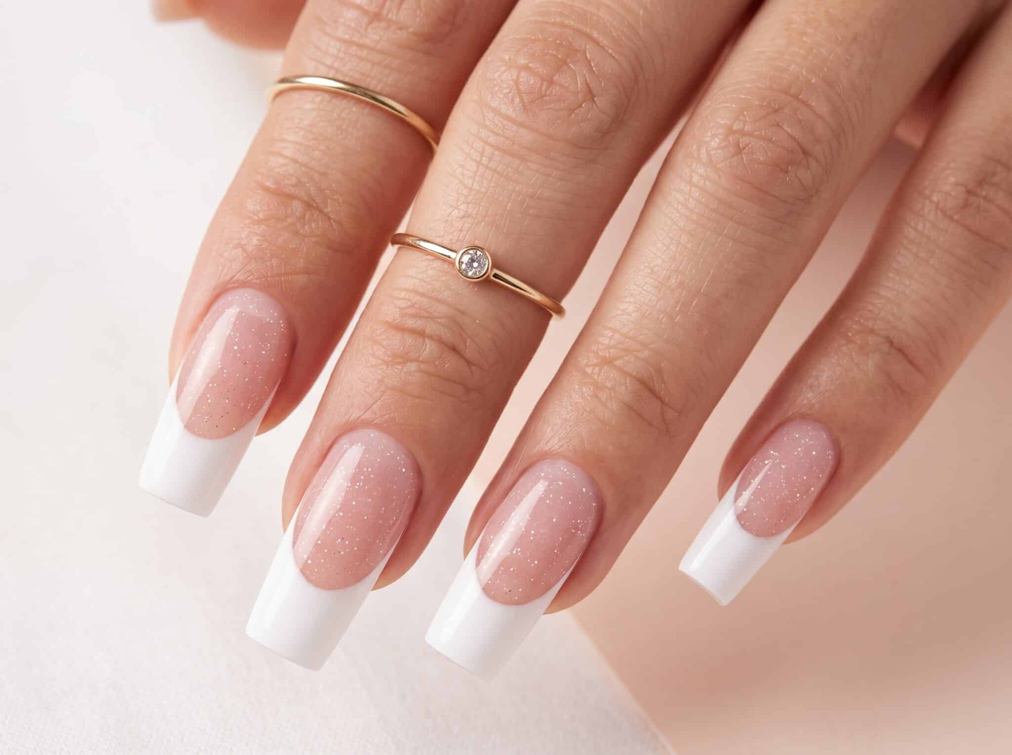 Square ombré pink and white full set nails with a soft blended fade