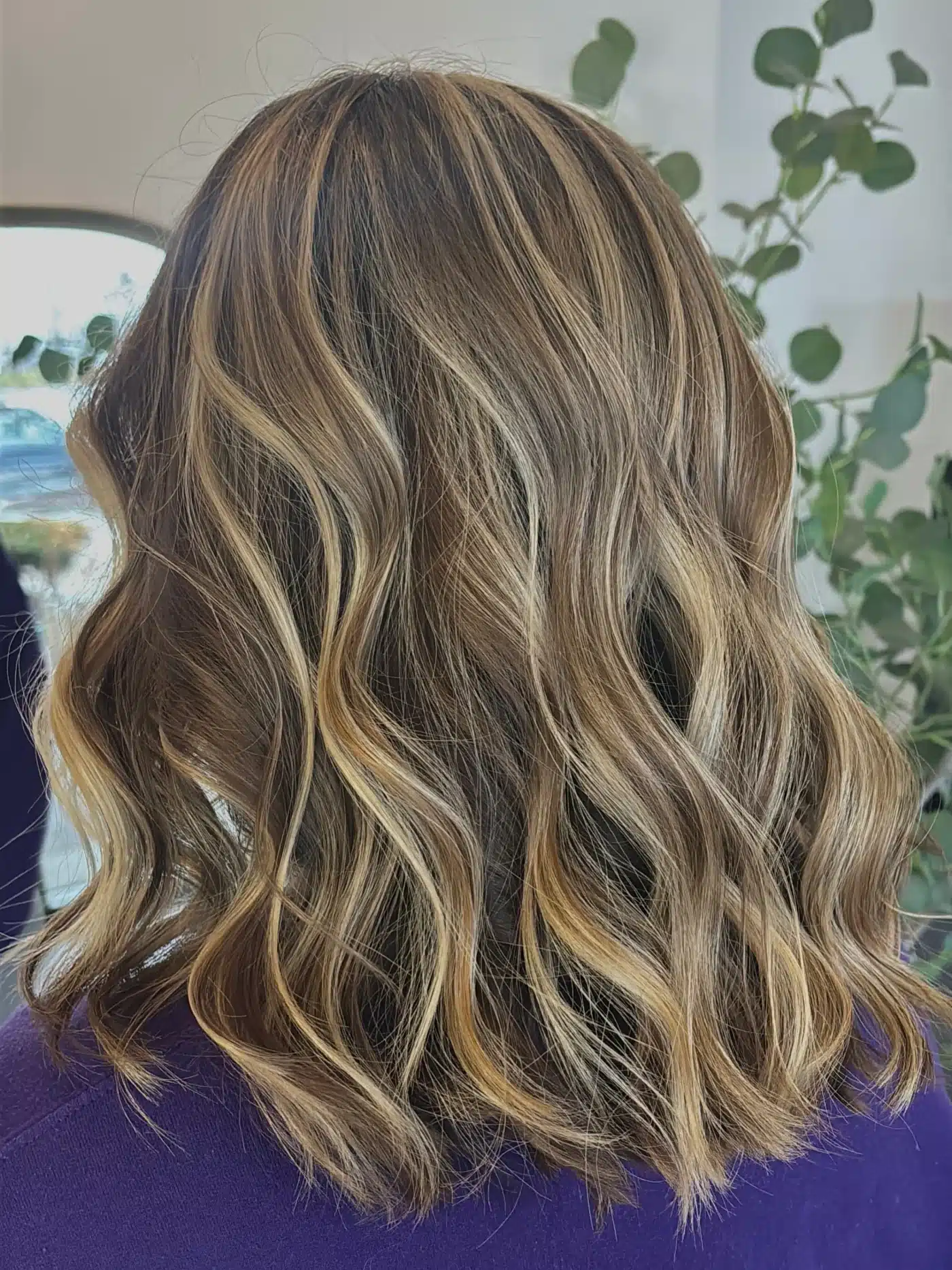 15 Chic Highlights Hair Color Ideas 11 Shoulder-length waves with caramel blonde highlights adding warmth and texture