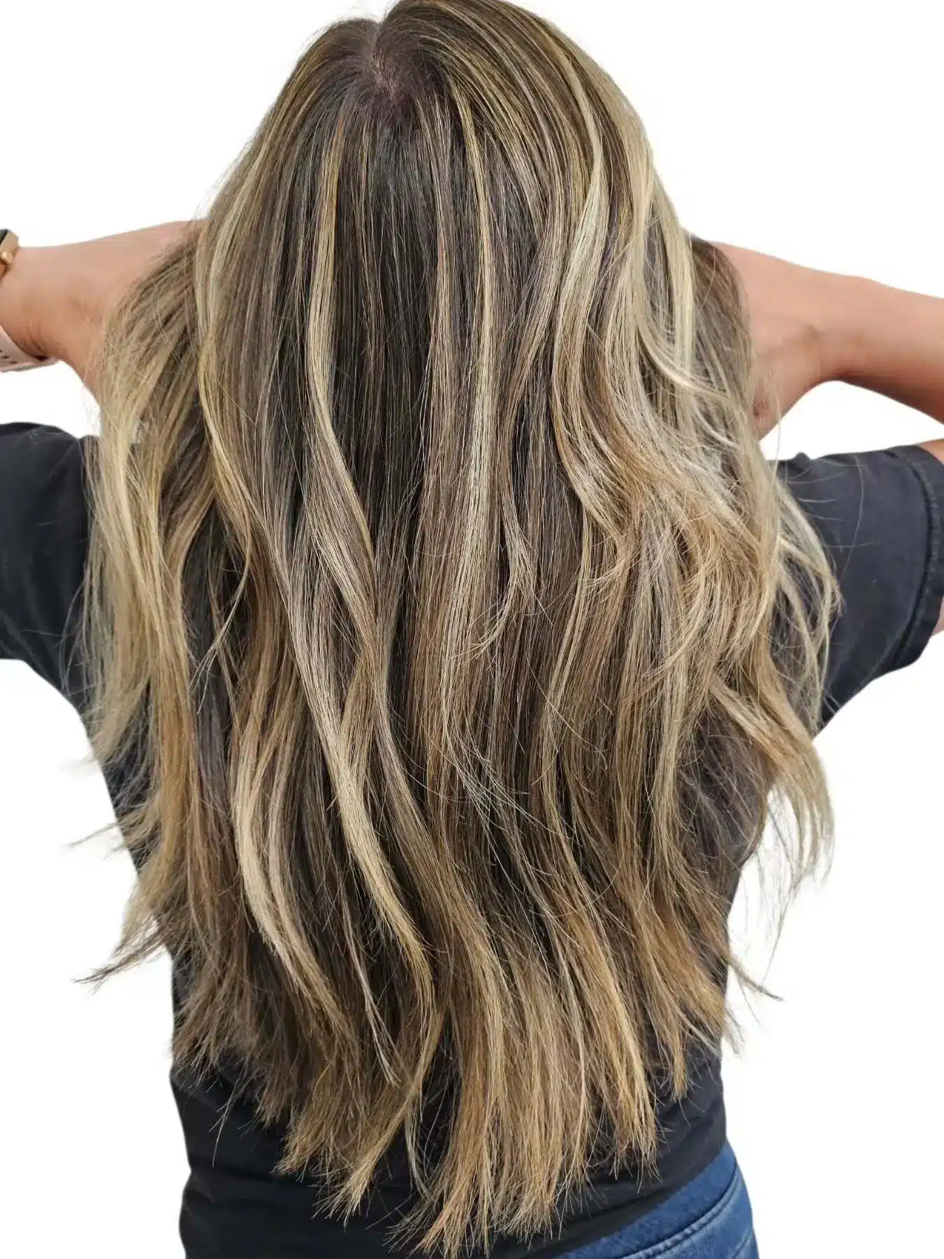 15 Chic Highlights Hair Color Ideas 13 Long tousled hair with honey blonde highlights enhancing textured layers