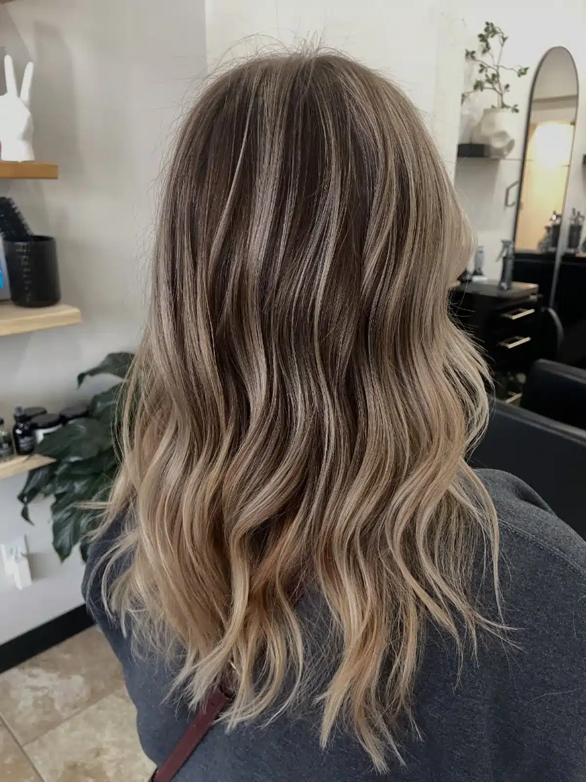 15 Chic Highlights Hair Color Ideas 14 Medium waves with mushroom blonde highlights for a cool sophisticated tone