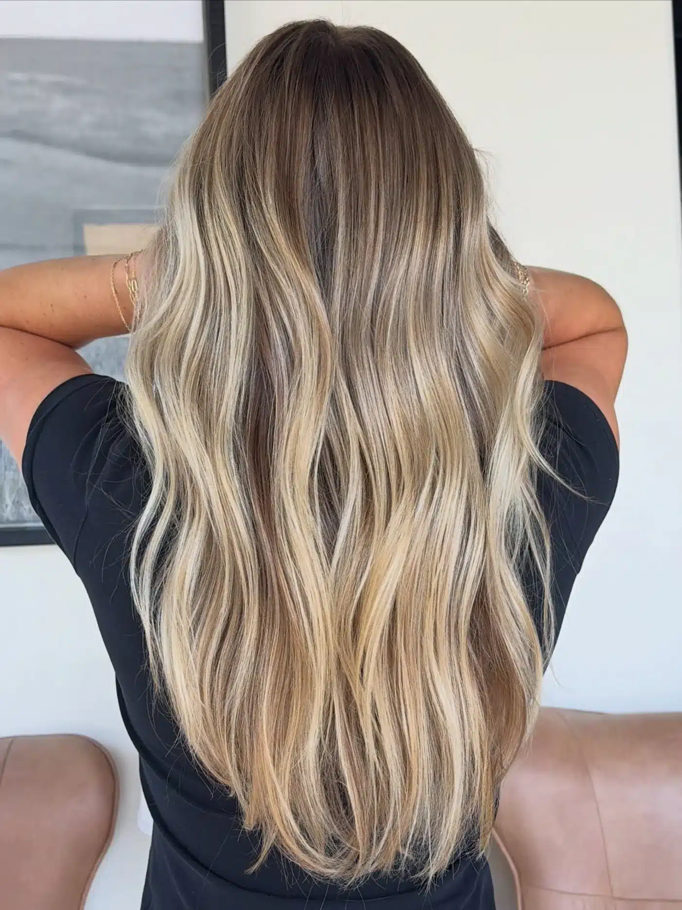 15 Chic Highlights Hair Color Ideas 4 Long beach waves with creamy blonde highlights demonstrating one of the 15 Chic Highlights Hair Color Ideas