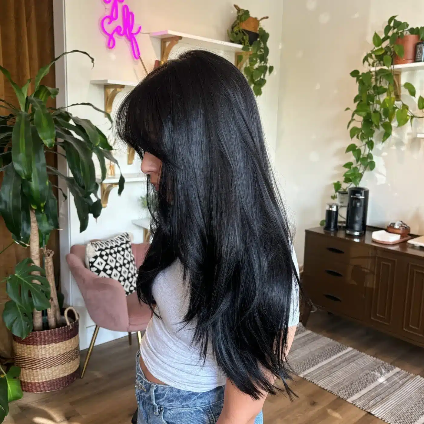 Blue-black long layers with curtain bangs showcasing 15 Glossy Dark Hair Color Ideas