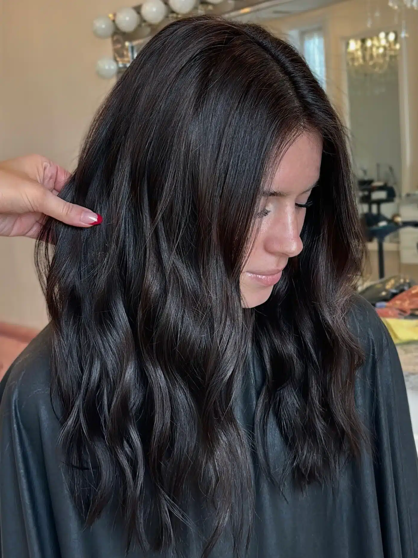 Deep brunette long loose waves representing 15 Glossy Dark Hair Color Ideas