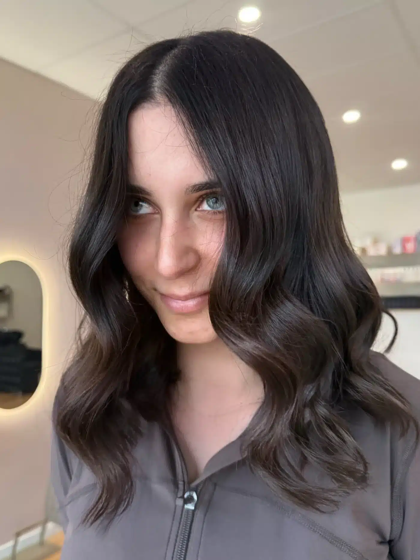 Dark chocolate lob with soft waves for a chic dark hair color