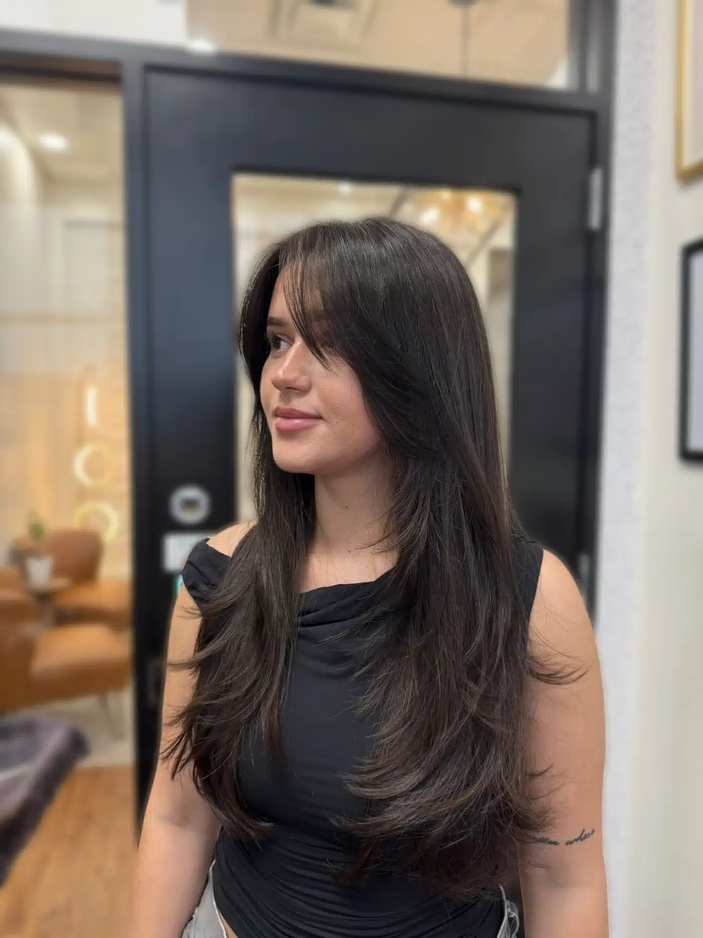 Deep brunette butterfly layers showcasing 15 Glossy Dark Hair Color Ideas