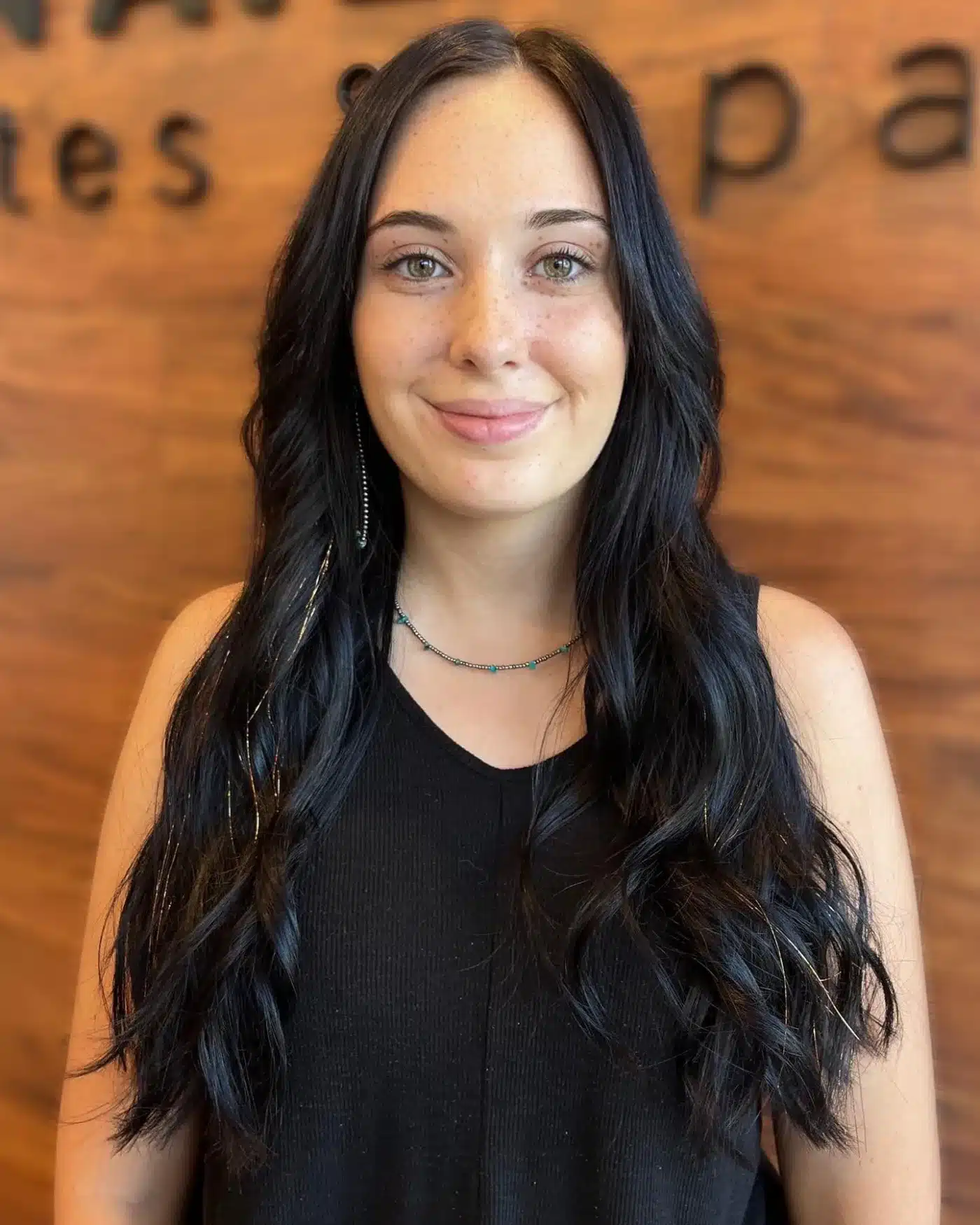 Soft black long layered waves for a sleek dark hair color look