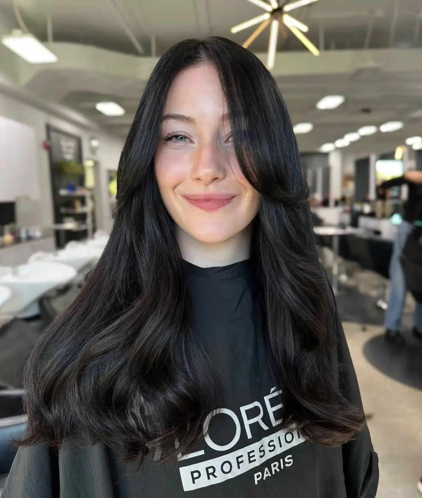Glossy soft black curtain layers highlighting 15 Glossy Dark Hair Color Ideas