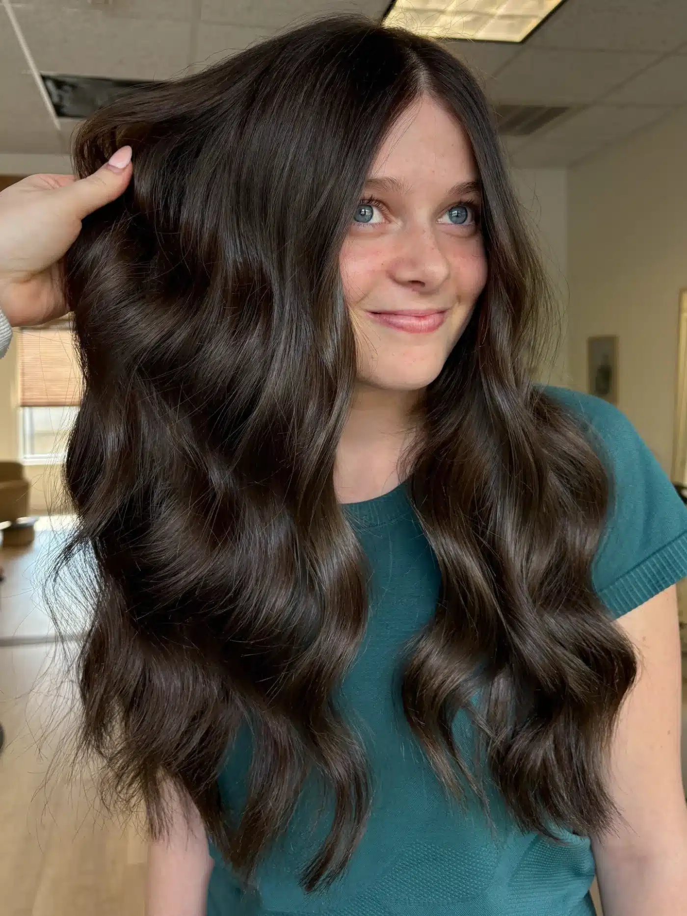 Deep chocolate brown voluminous waves for a rich dark hair color