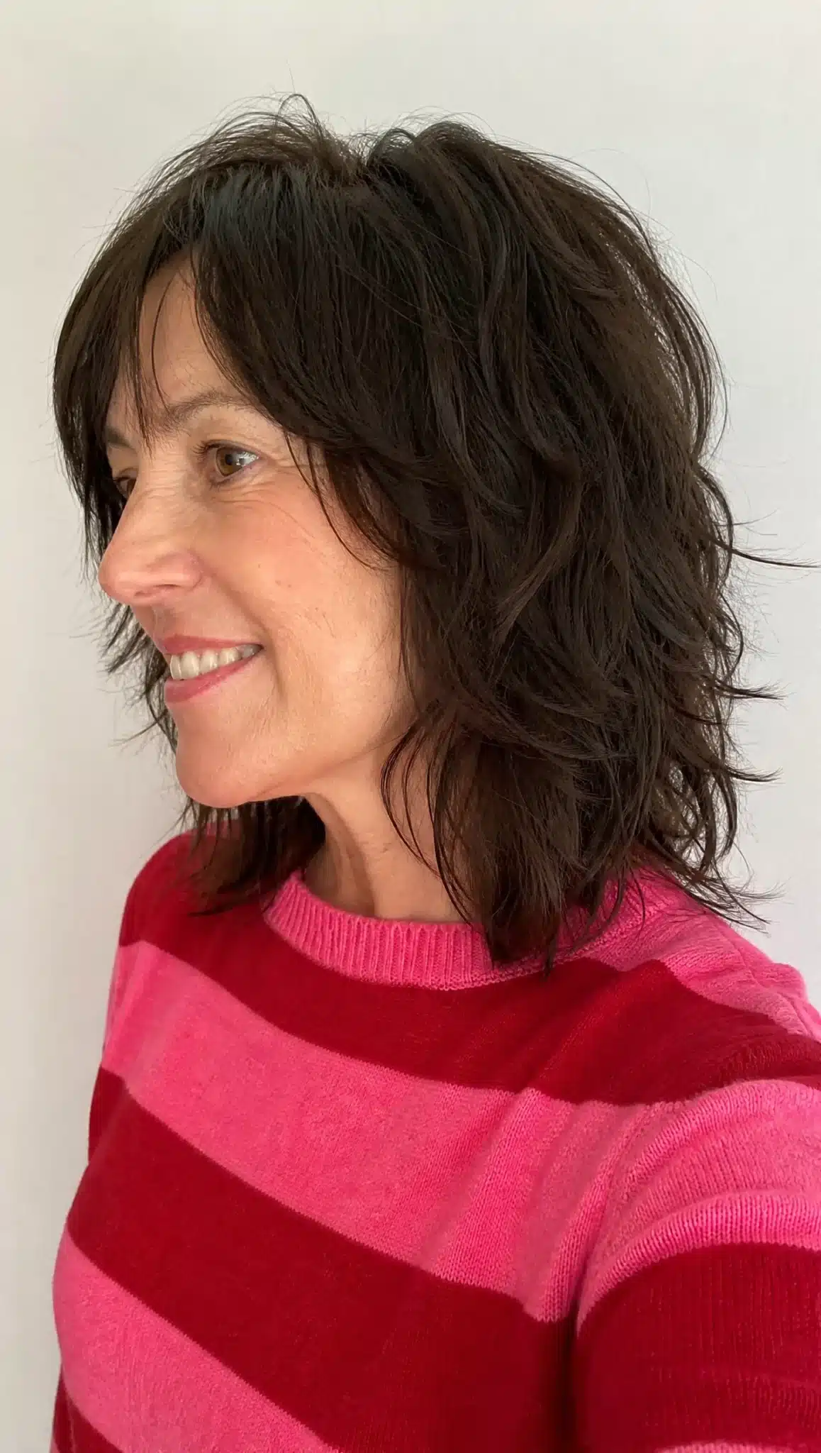 27 Chic Shoulder Length Hairstyles For Women Over 60 13 Shoulder length shag with dark brown hair representing 27 chic shoulder length hairstyles for women over 60.