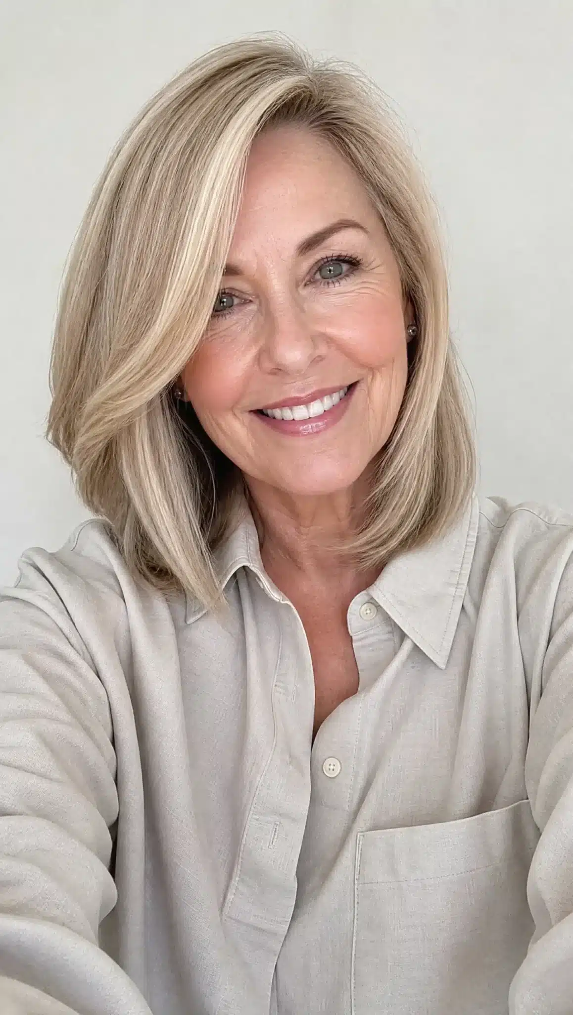 27 Chic Shoulder Length Hairstyles For Women Over 60 14 Side-parted lob with beige blonde hair displaying 27 chic shoulder length hairstyles for women over 60.