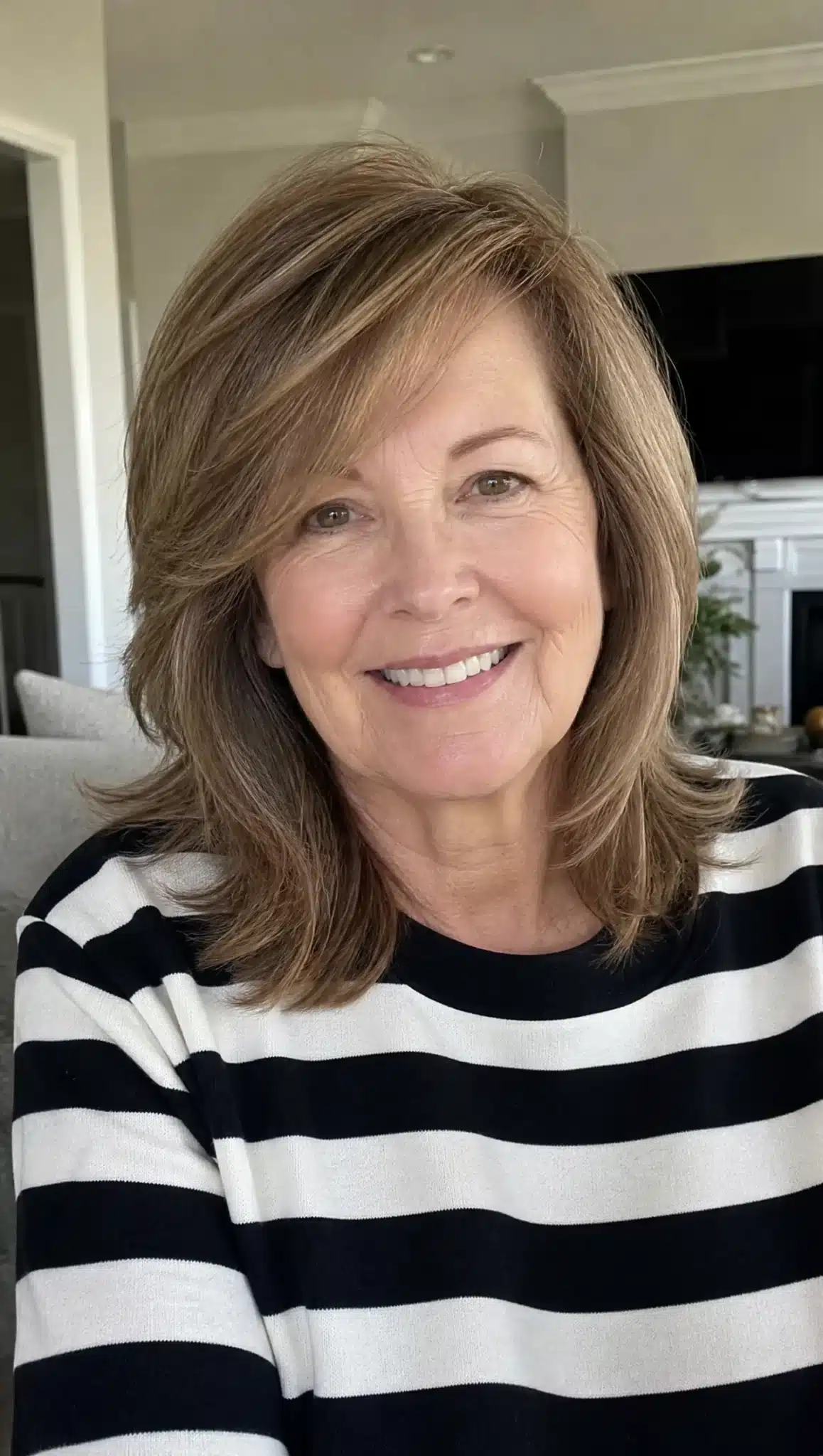27 Chic Shoulder Length Hairstyles For Women Over 60 22 Side-swept layered cut with light brown hair illustrating 27 chic shoulder length hairstyles for women over 60.