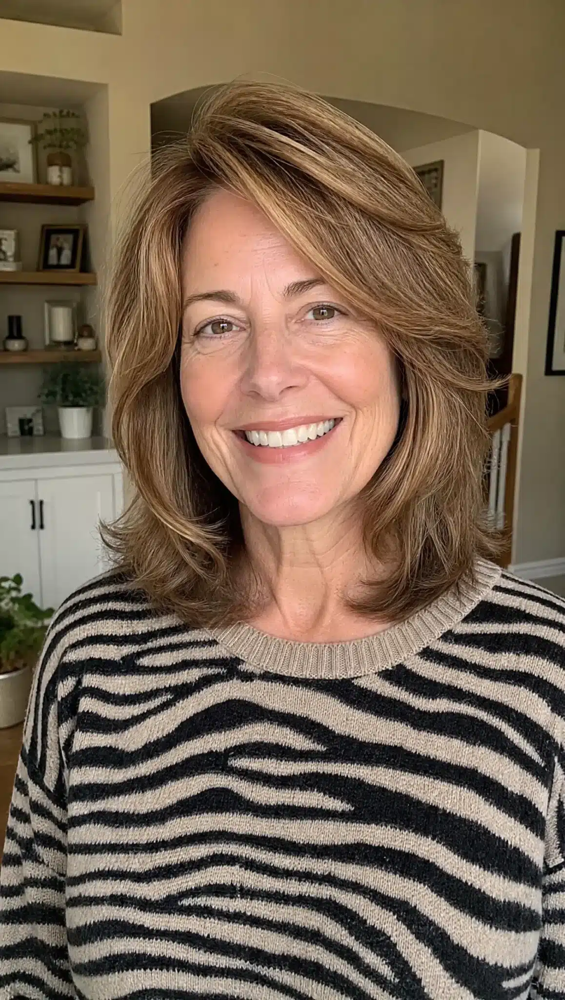 27 Chic Shoulder Length Hairstyles For Women Over 60 28 Voluminous layered lob with golden brown hair representing 27 chic shoulder length hairstyles for women over 60.